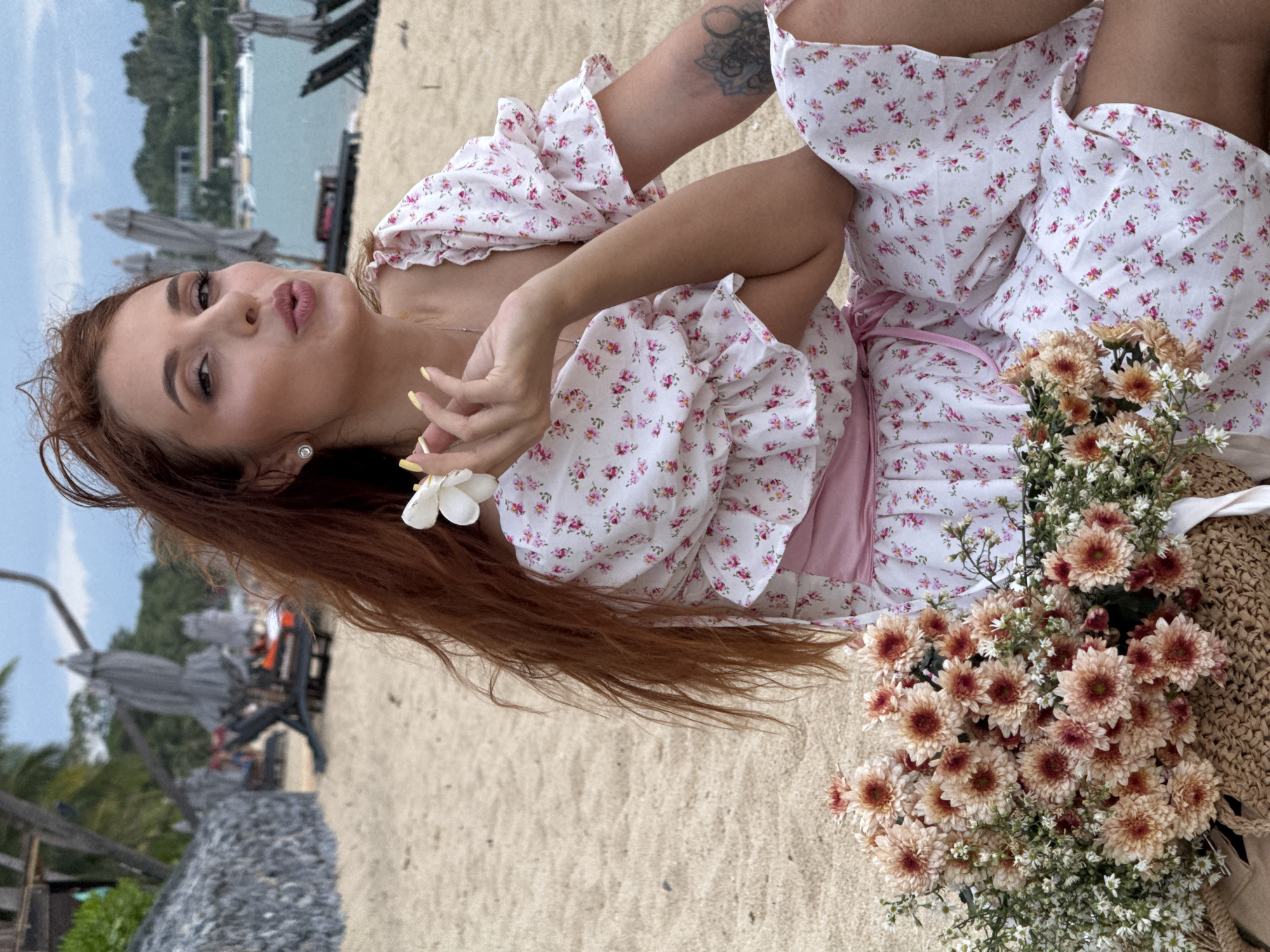 Floral dress and flowers on a Ko Samui beach