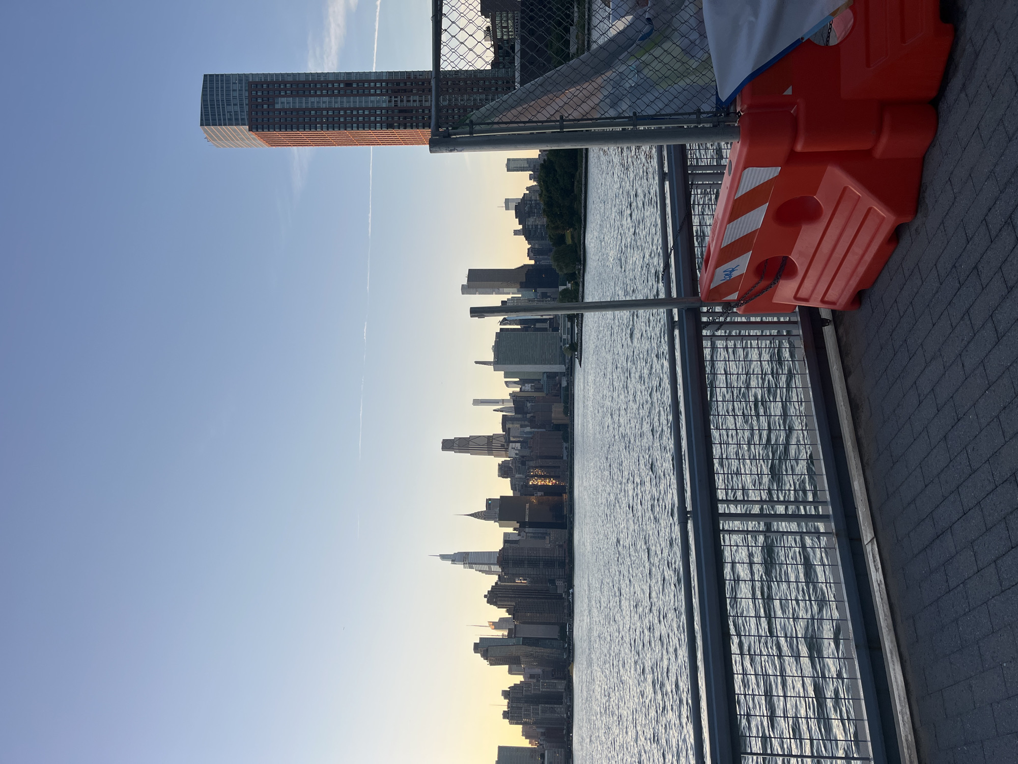 Manhattan skyline at dusk, seen from East River waterfront