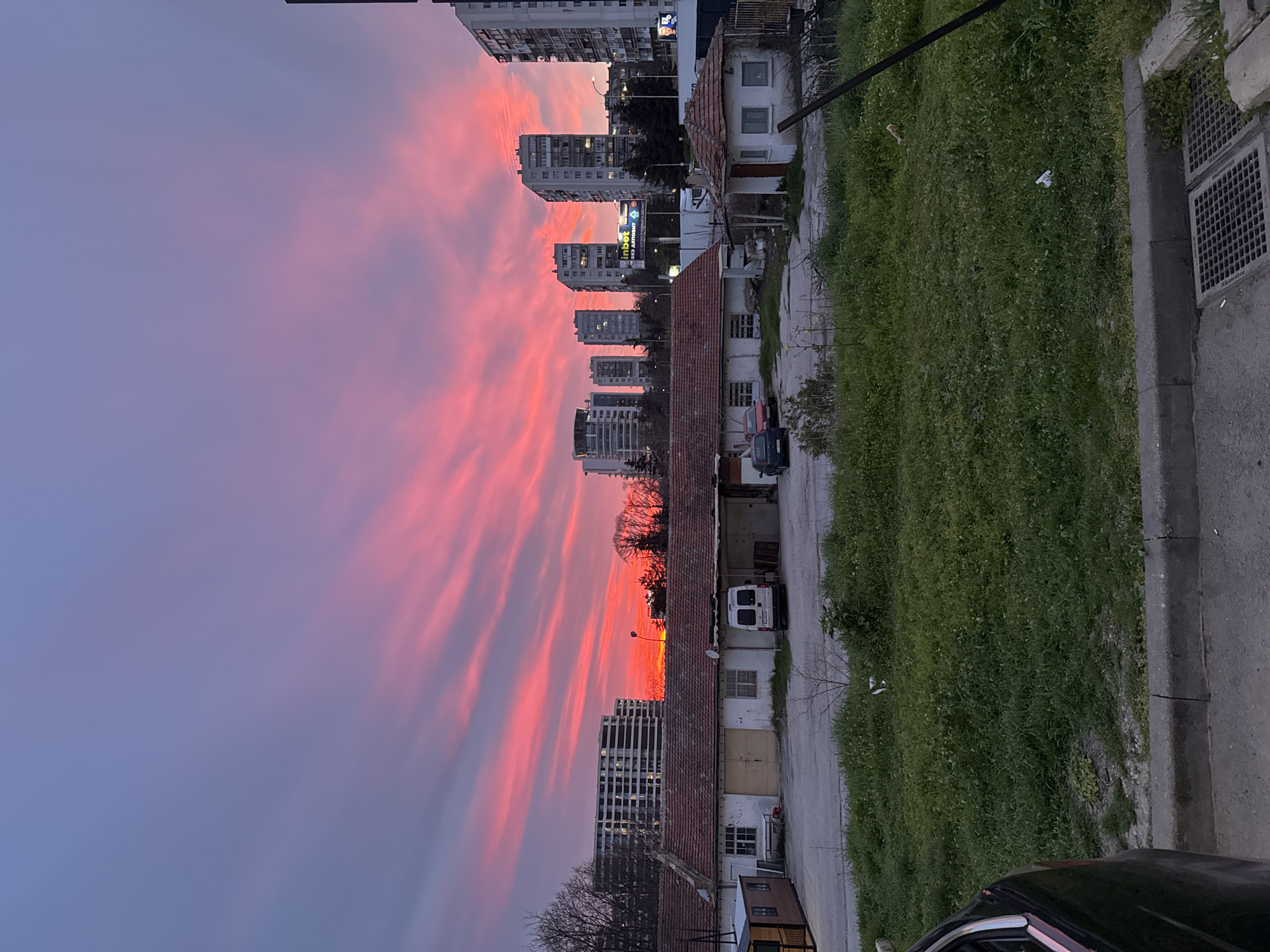 Dramatic pink-purple sunset illuminates Varna cityscape