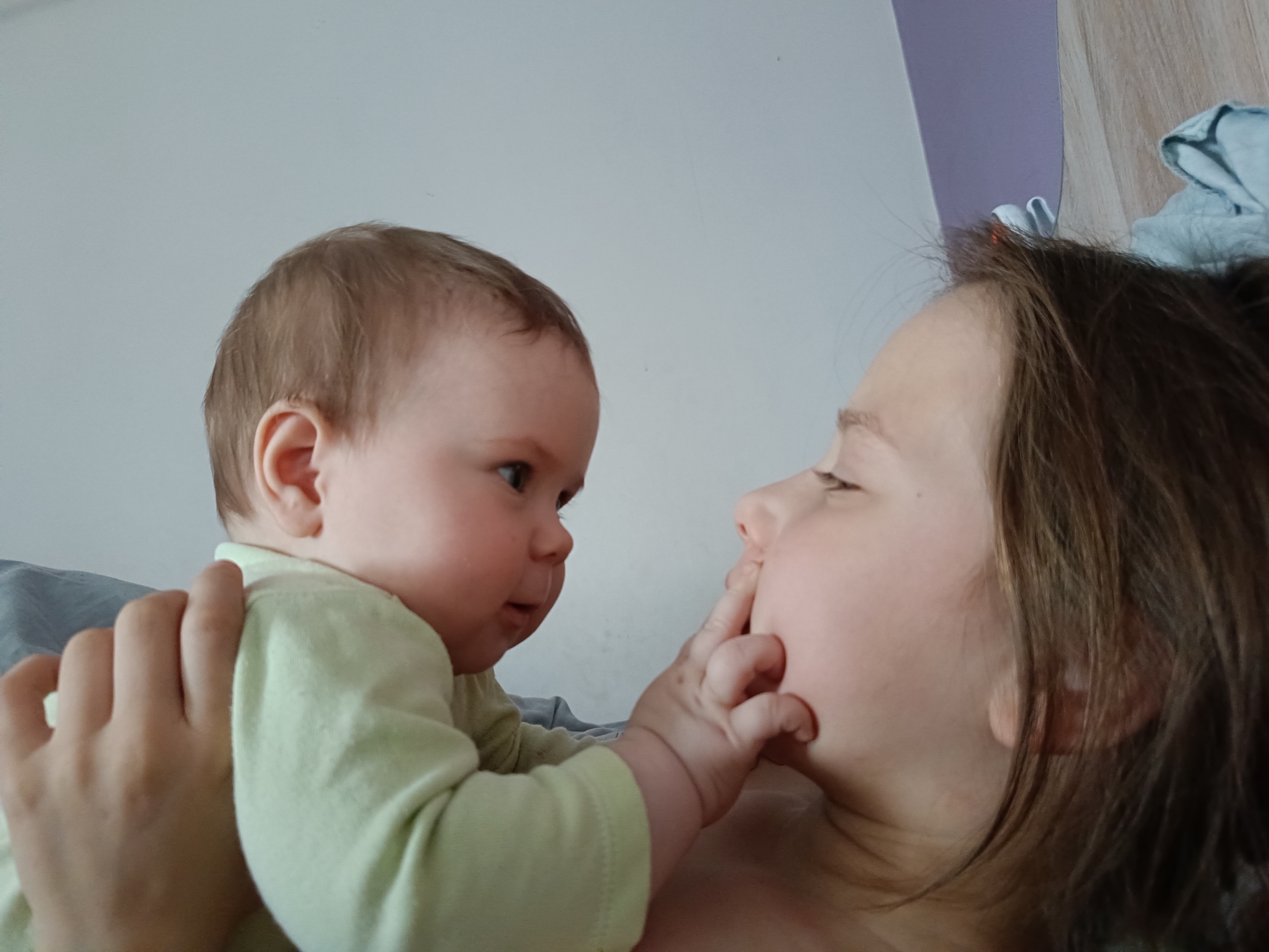 Tender moment captured between adult and baby in Rusalevka