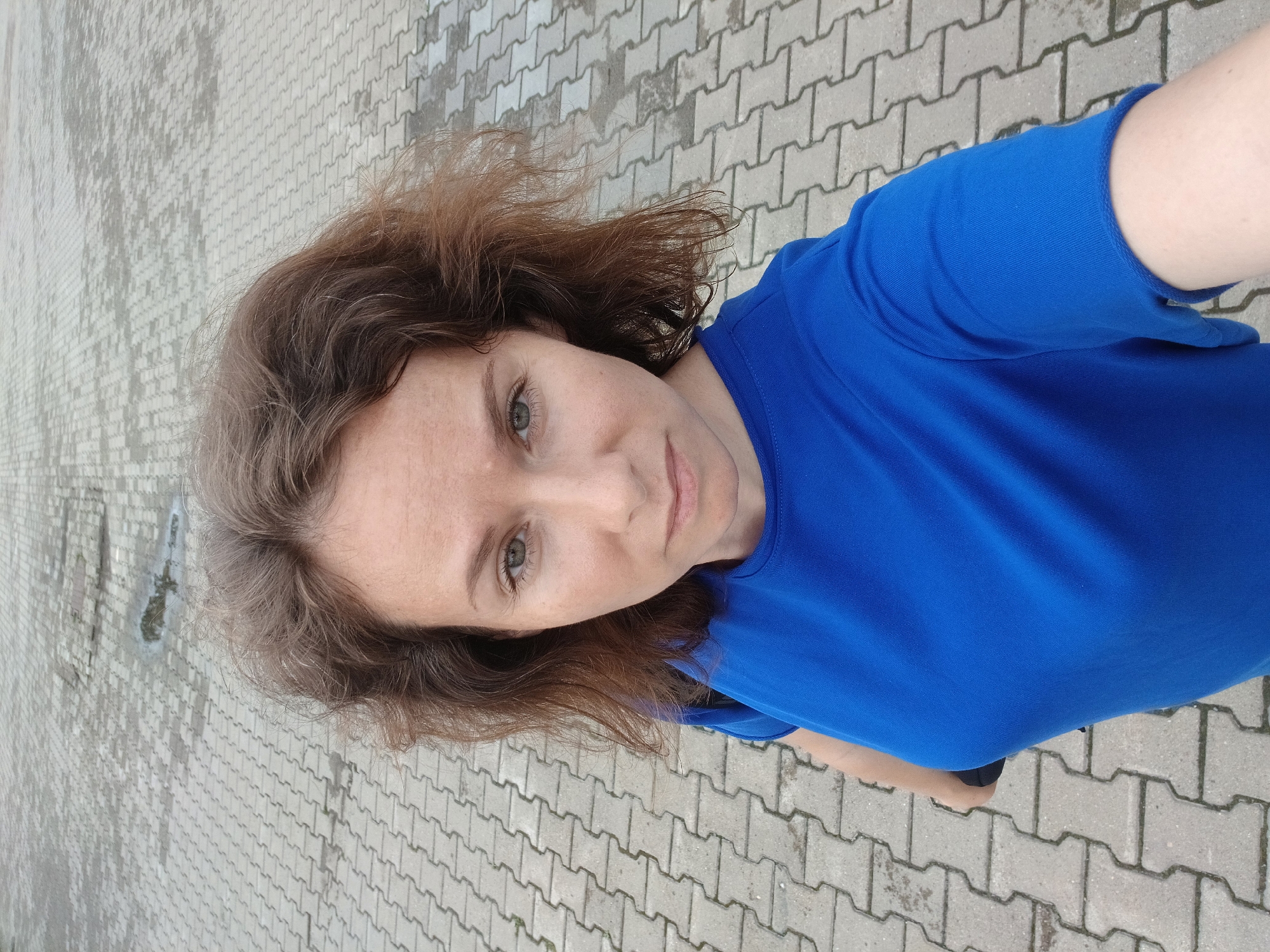Selfie and cityscape from a rainy Yekaterinburg square