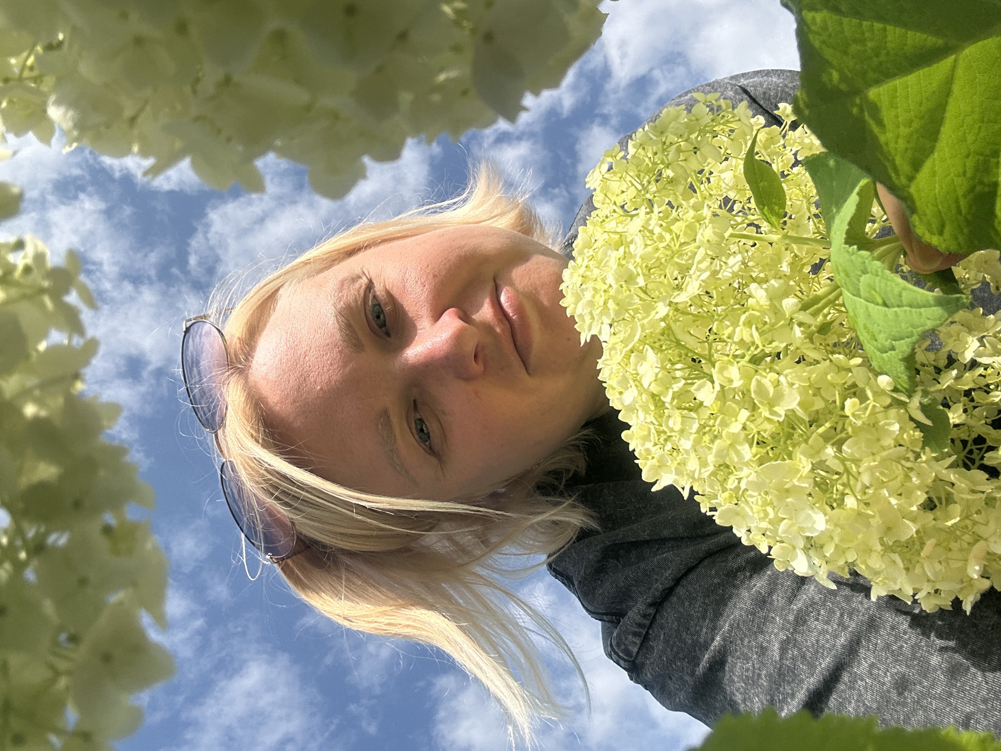 Outdoor selfie session among blooming flowers in Chaikovsky, Russia