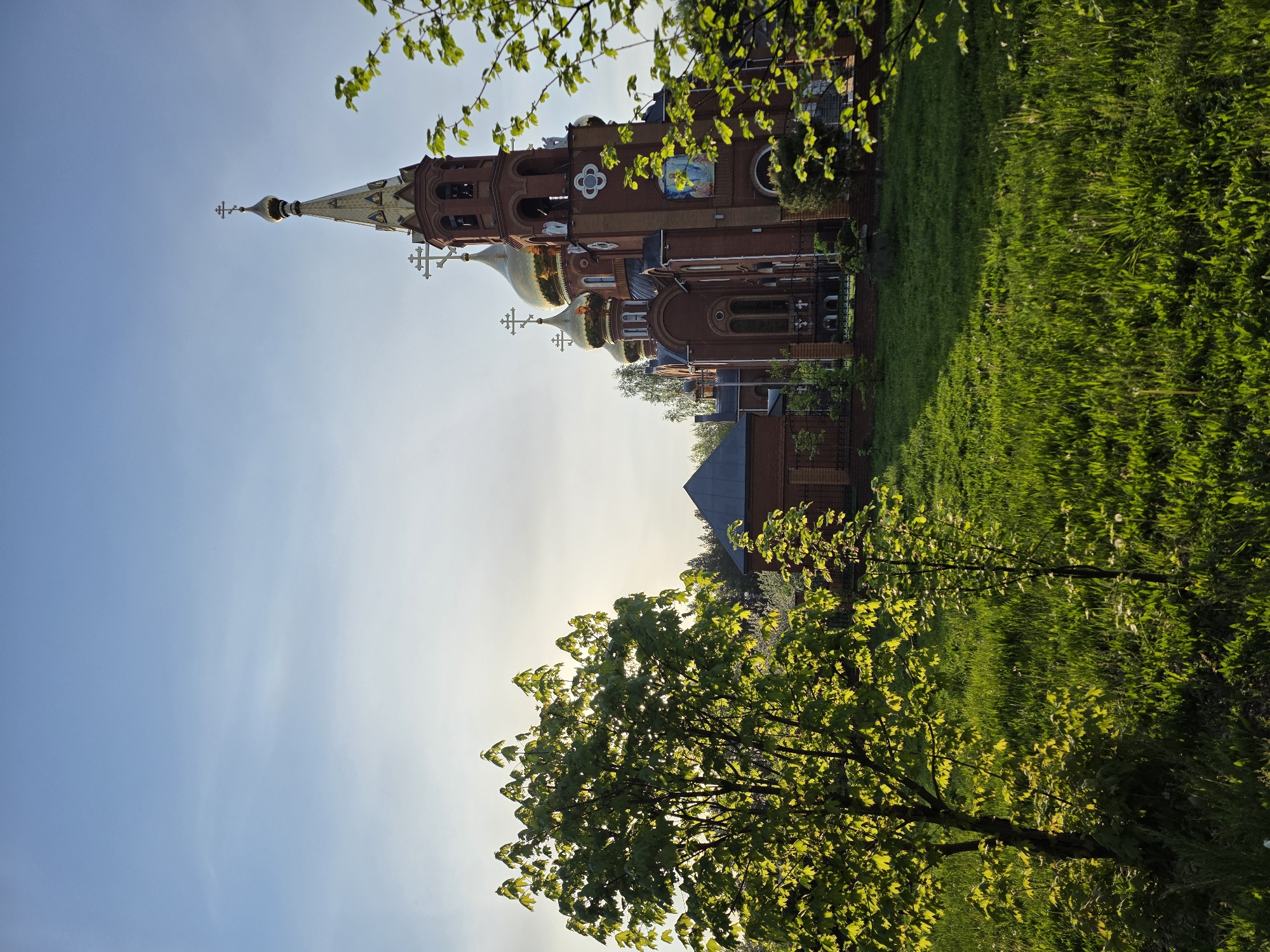 Woman visits Orthodox church grounds in Chaikovsky, Russia