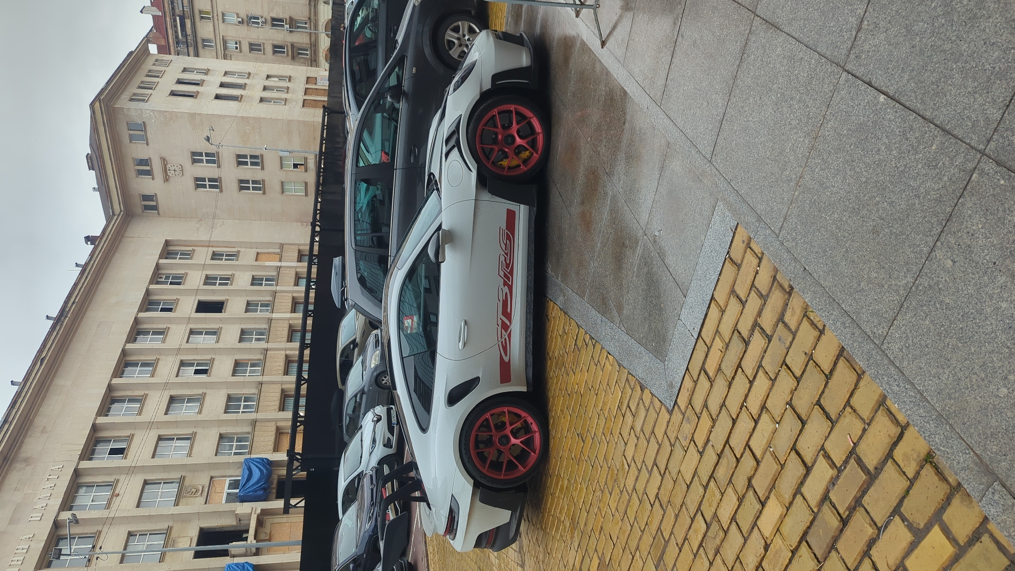 Sofia street scenes feature historic churches, luxury sports car