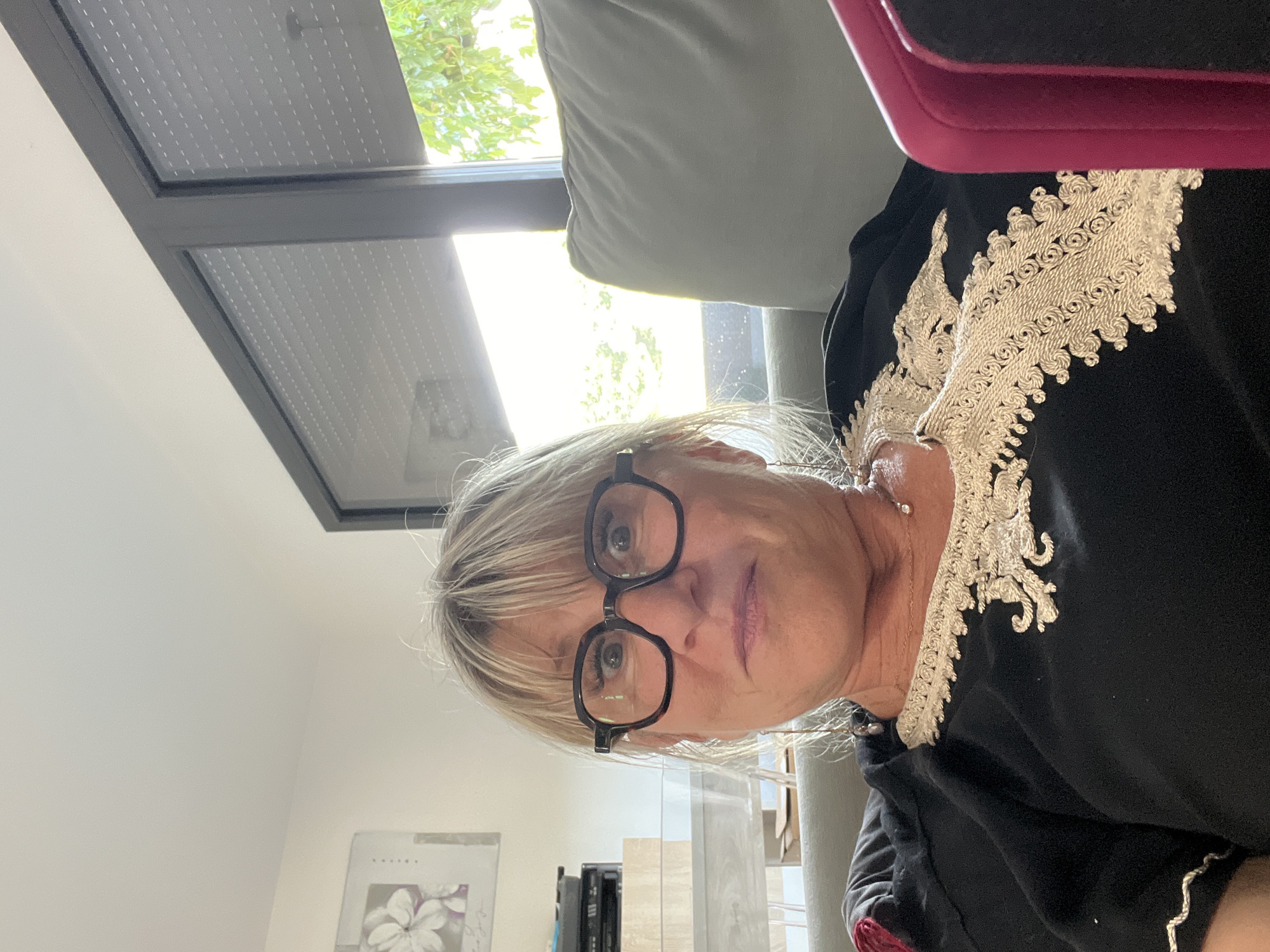 Portrait in Chambœuf, France, glasses and ornate black garment