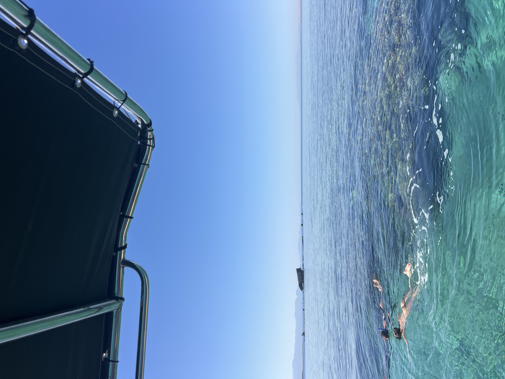 Calm Red Sea waters off Egypt's coast, coral reef visible below