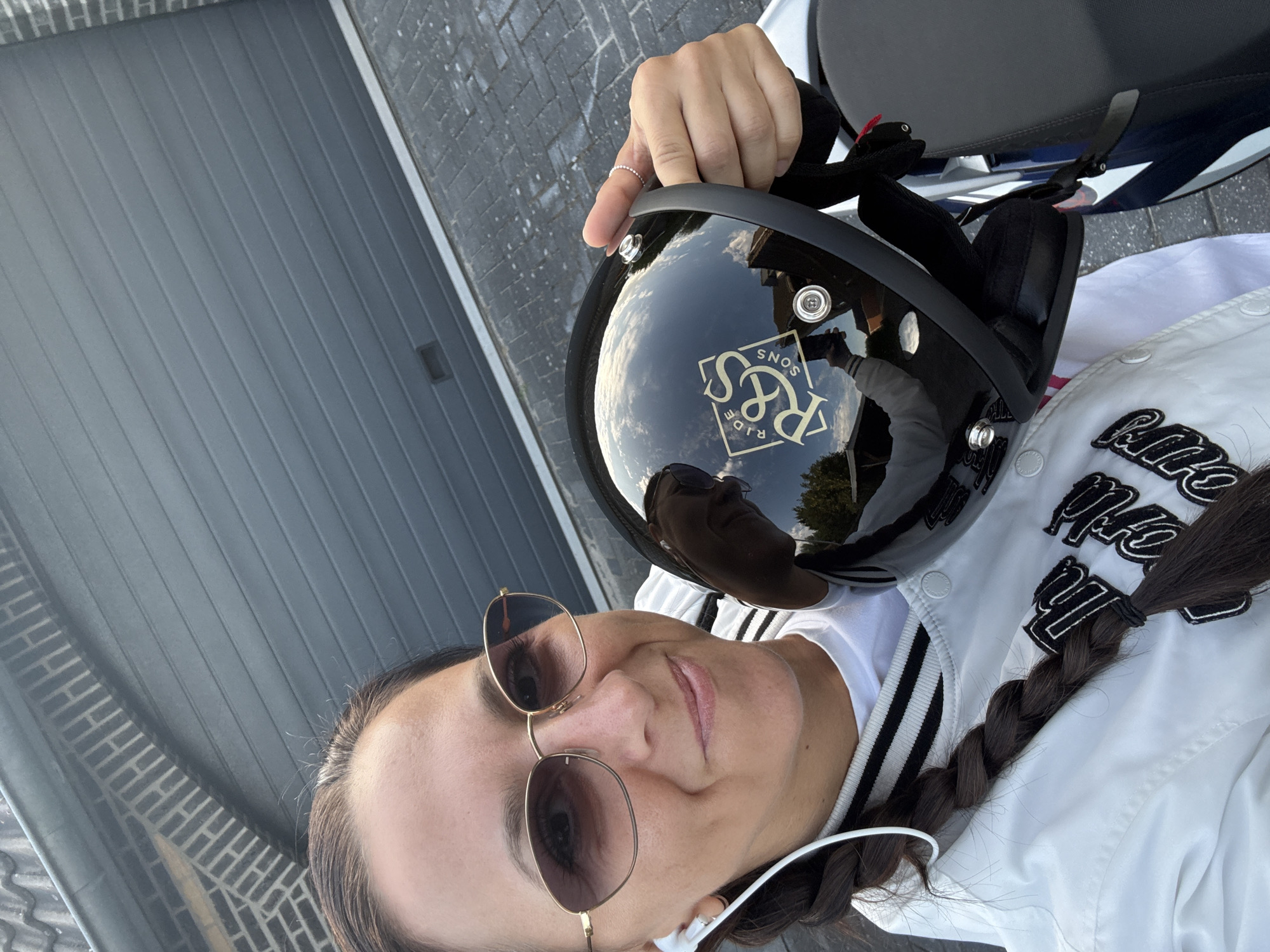 Motorcycle helmet in hand, ready to ride in Leek