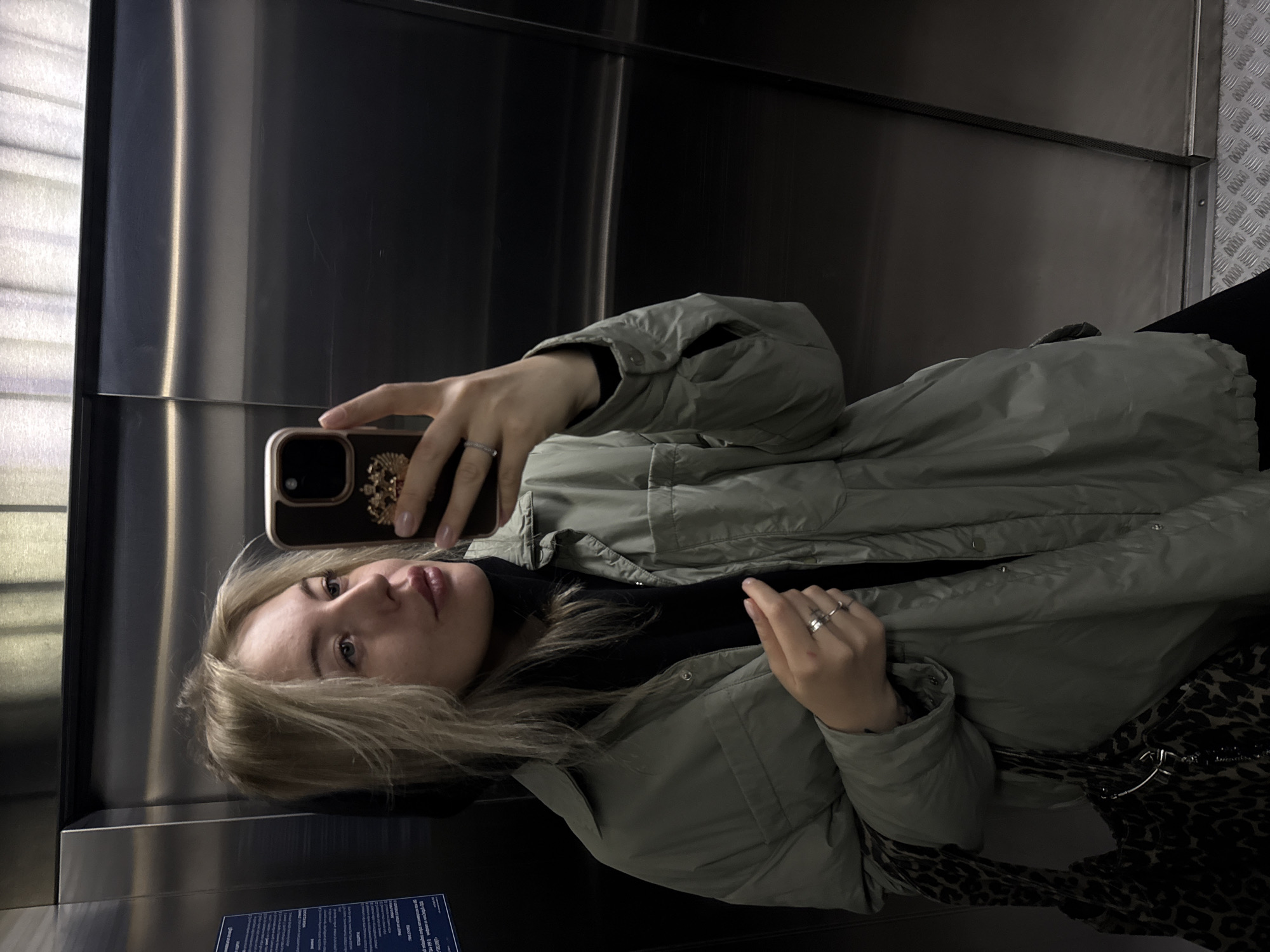 Woman Takes Selfie in Elevator in Krasnoyarsk