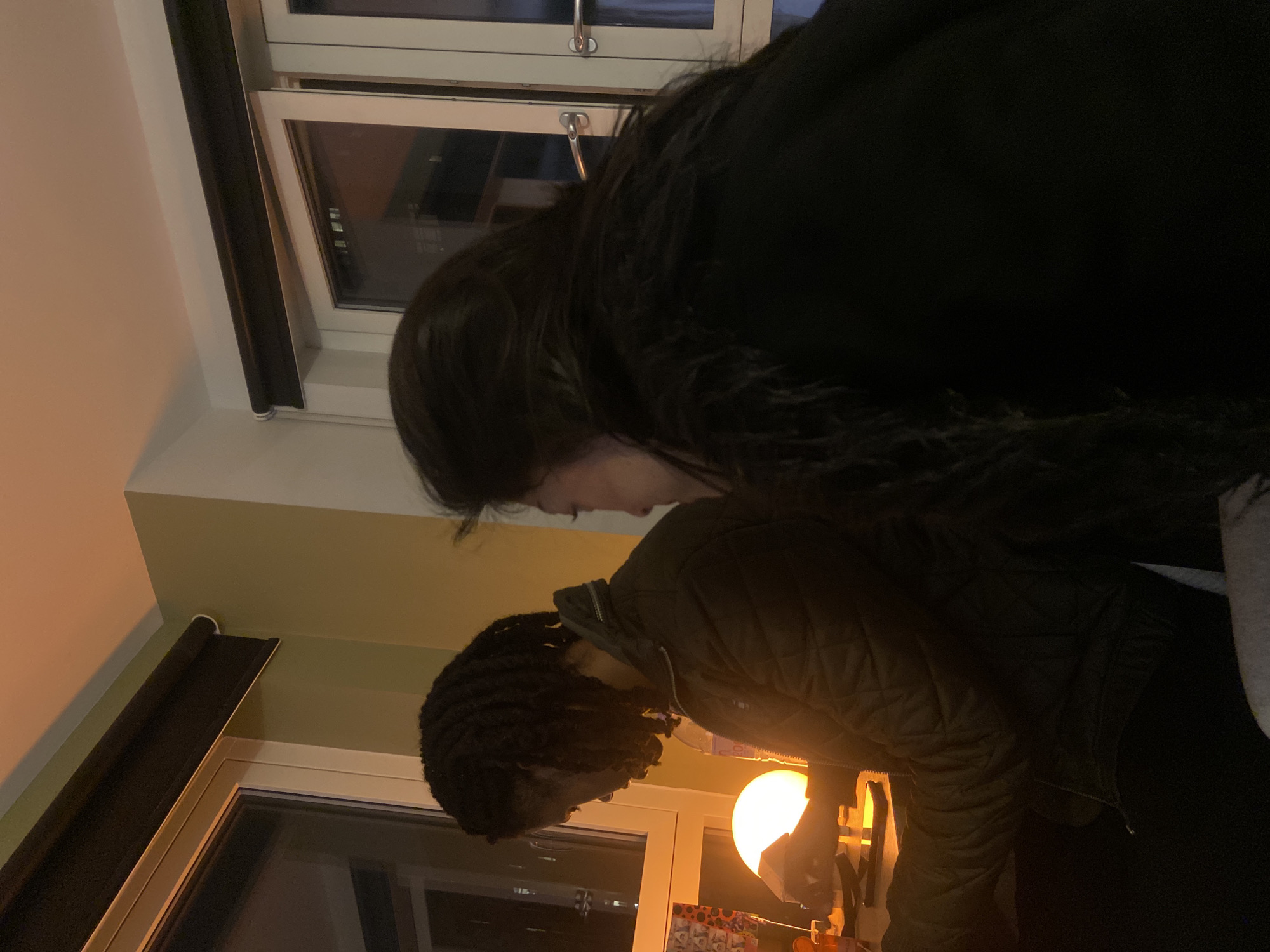 Two people spotted in dimly lit London room