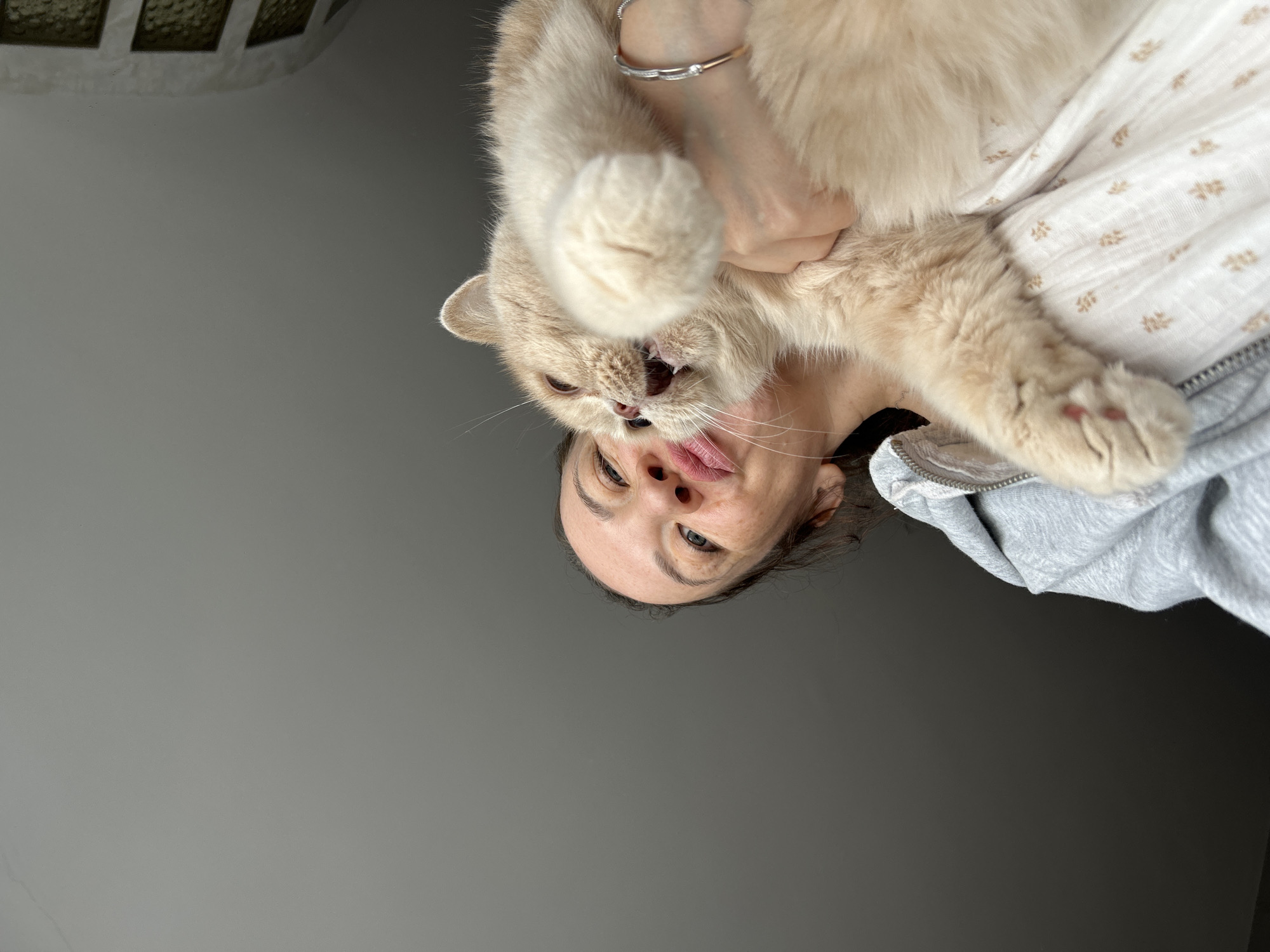 Woman shares morning moments with cat and child in Chaikovsky