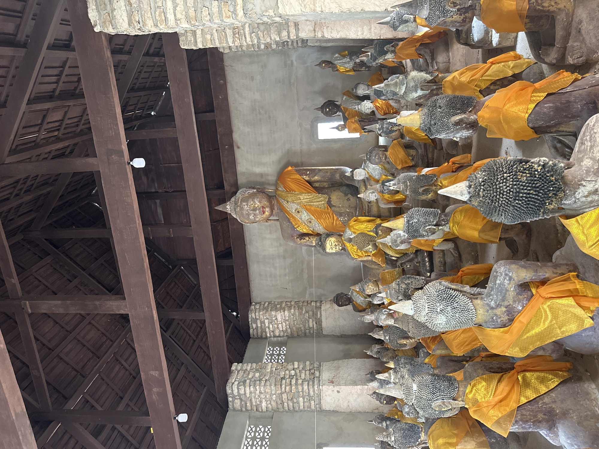 Inside a richly detailed Thai temple complex in Baan Harn
