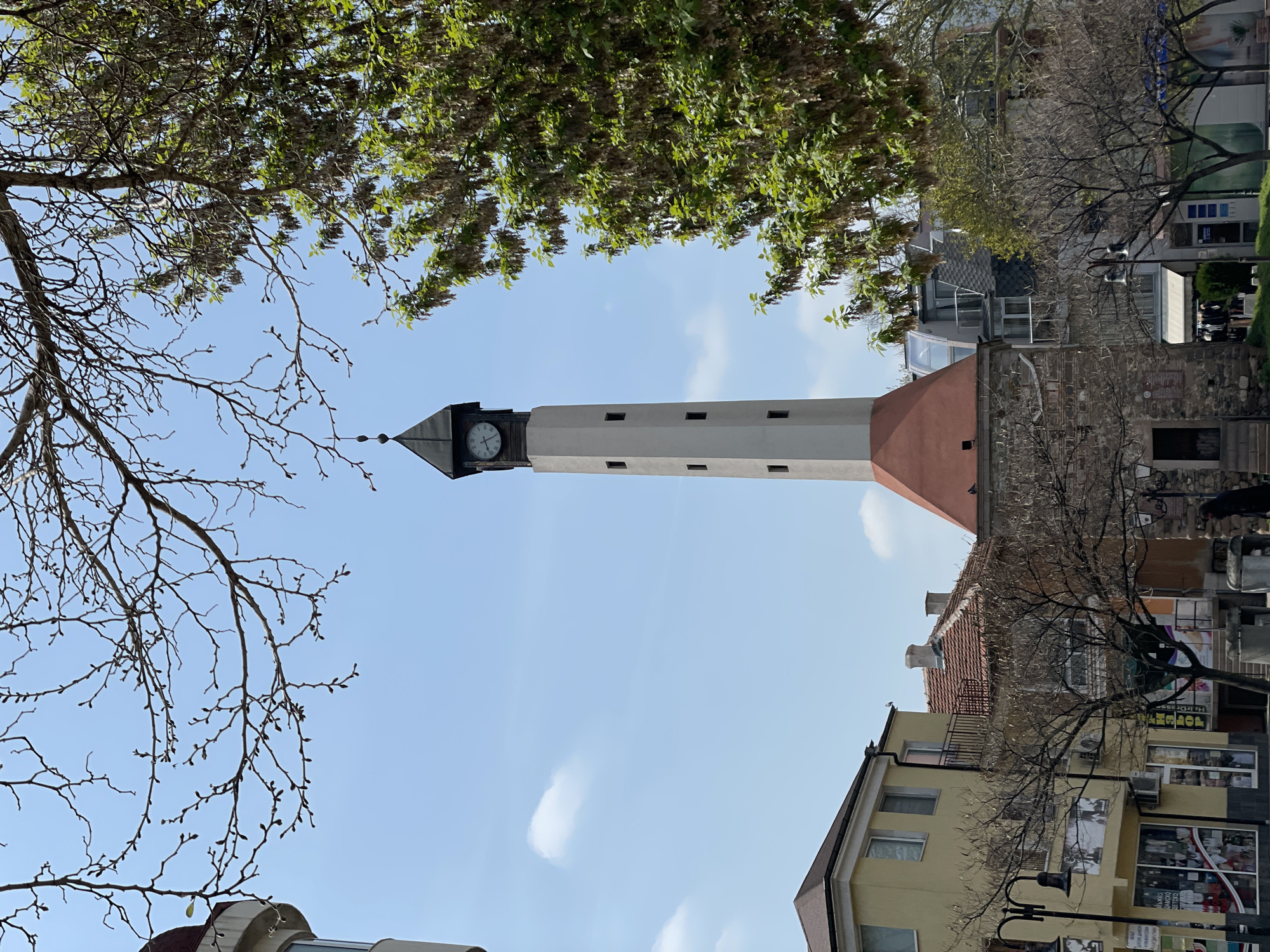 Visitor documents Pazardzhik clock tower from multiple angles
