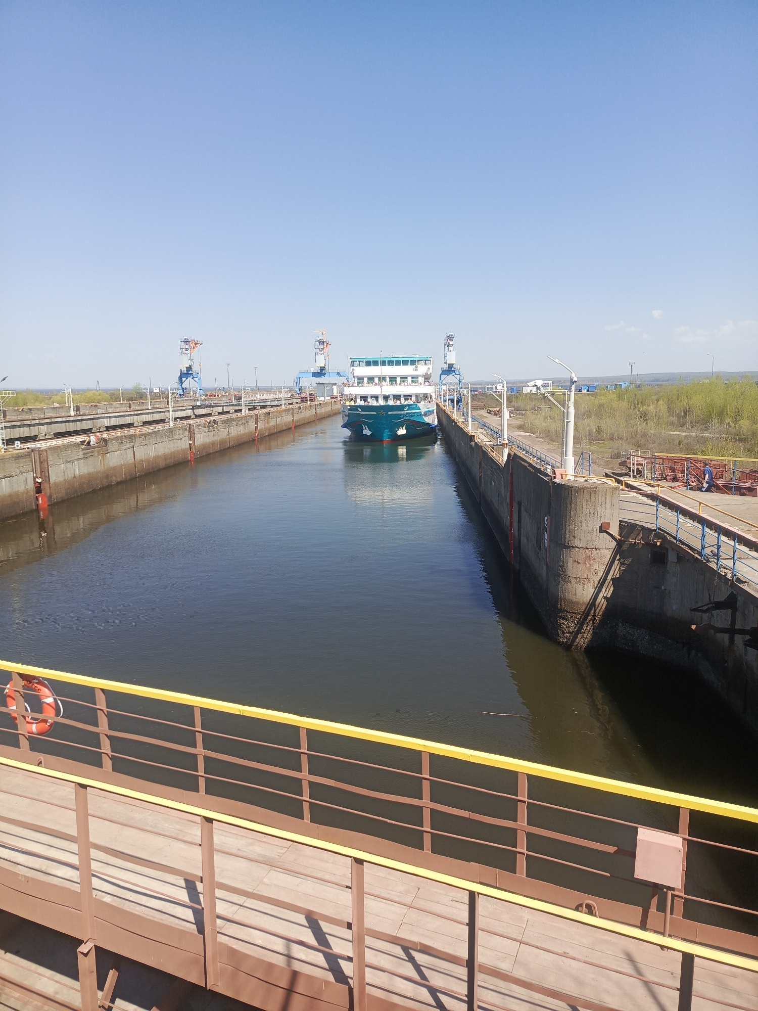 Ship transits locks on Kama River in Chaikovsky, Russia