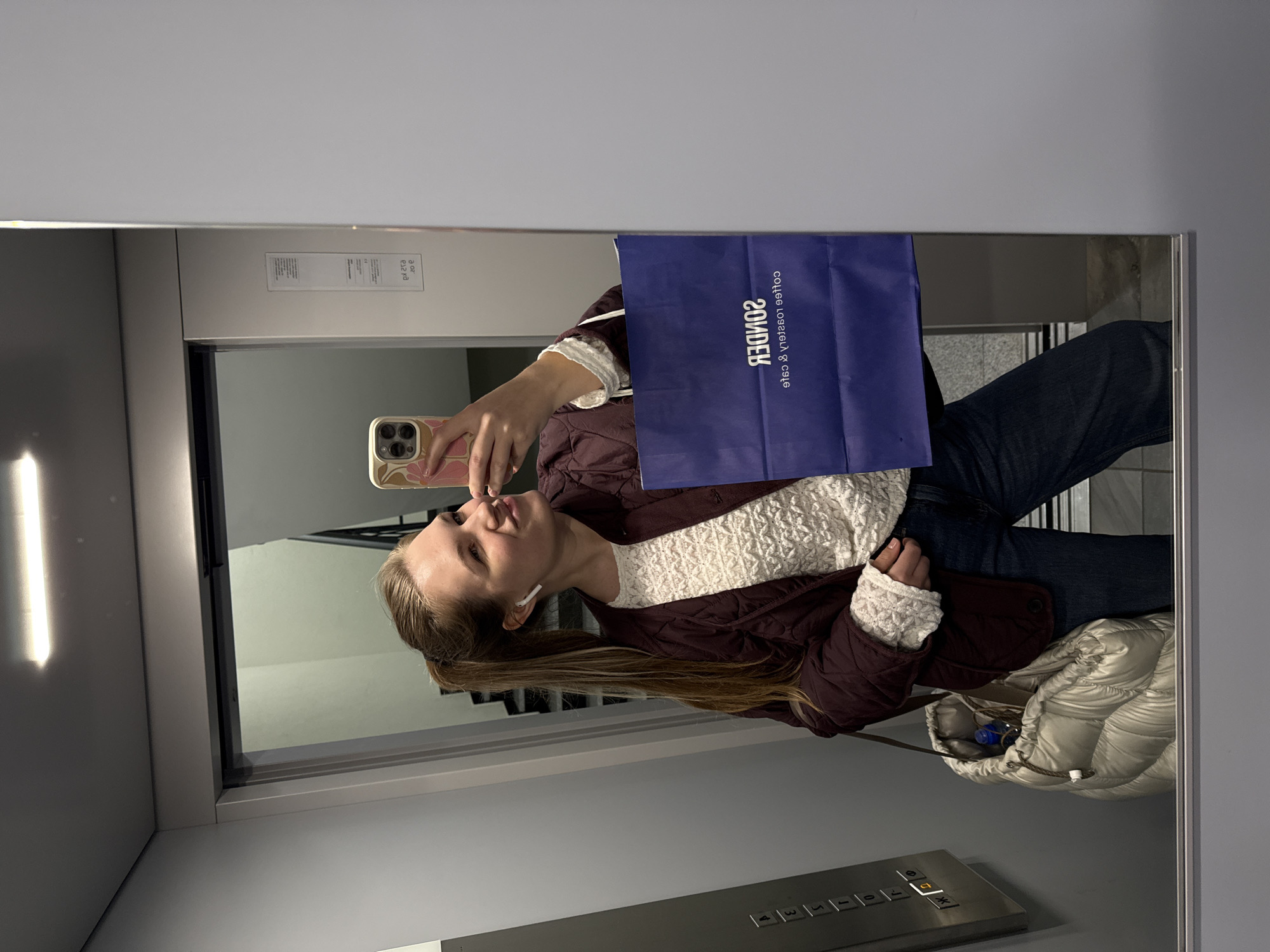 Woman takes selfie in elevator in Belgrade suburb