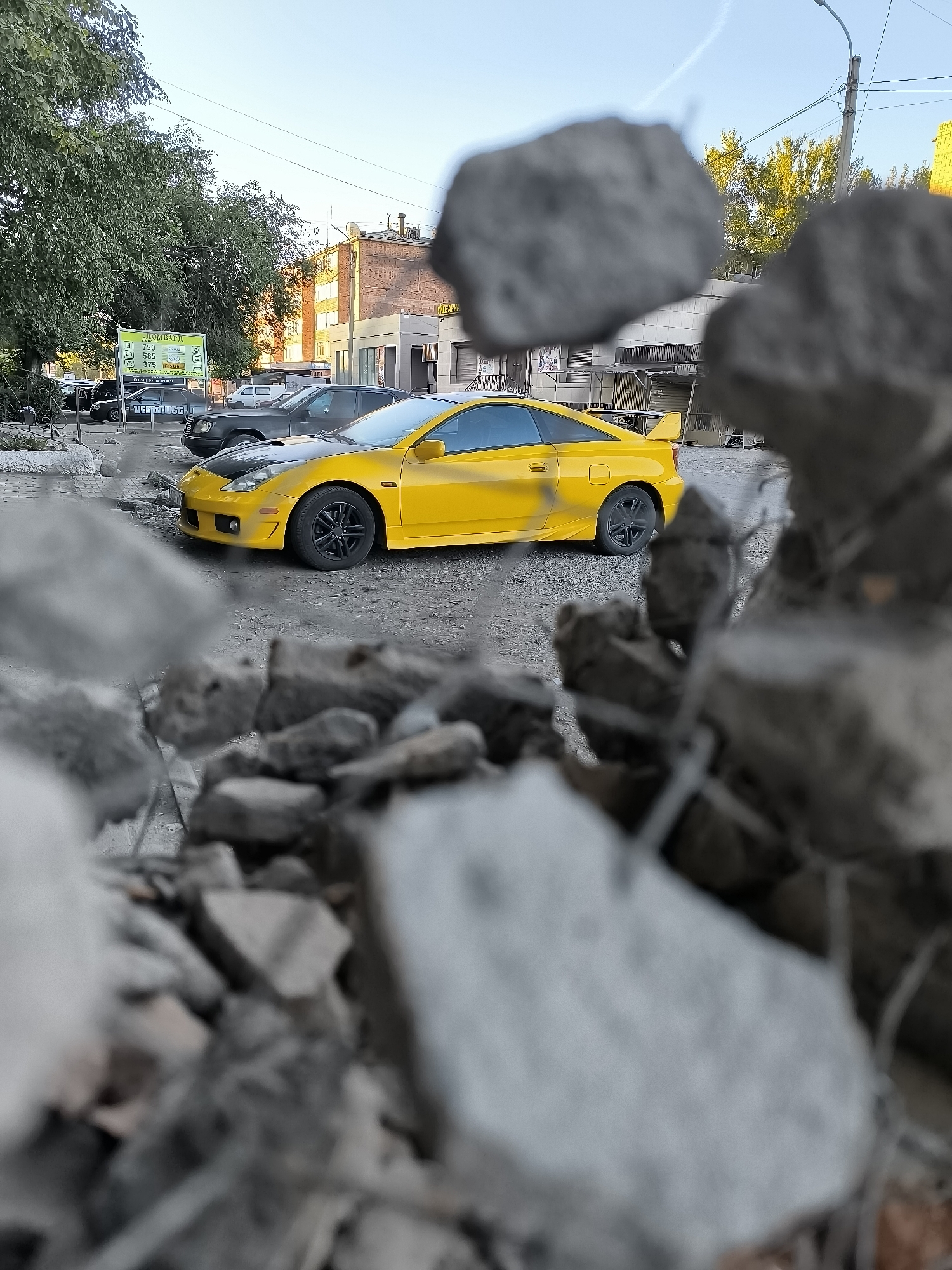 Two-tone Toyota Celica parked outside Qarağandı city administration