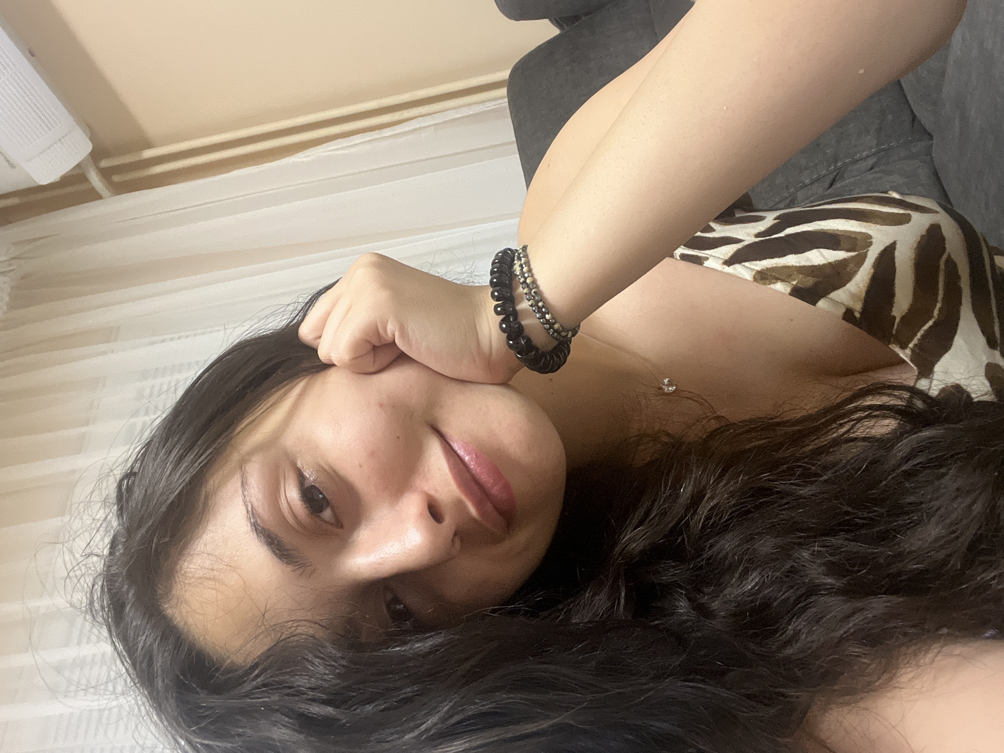 Relaxed indoor selfie with beaded bracelets, Sofia