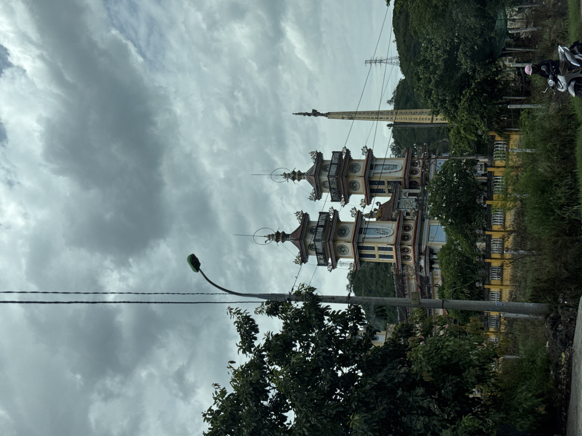 Driving past a temple on Highway QL1, Vĩnh Lương