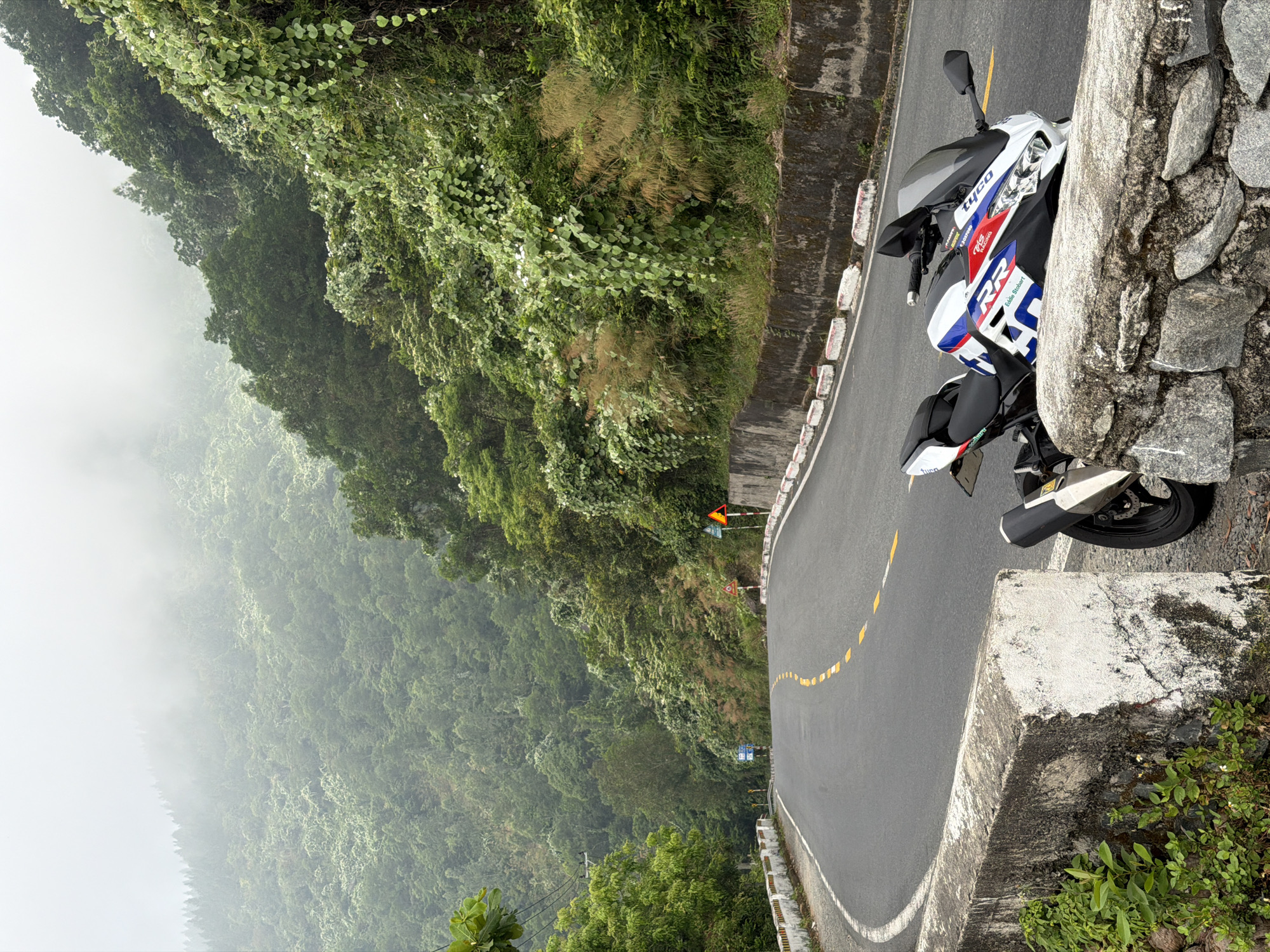 Motorcyclist spotted on winding road in Đà Nẵng, Vietnam