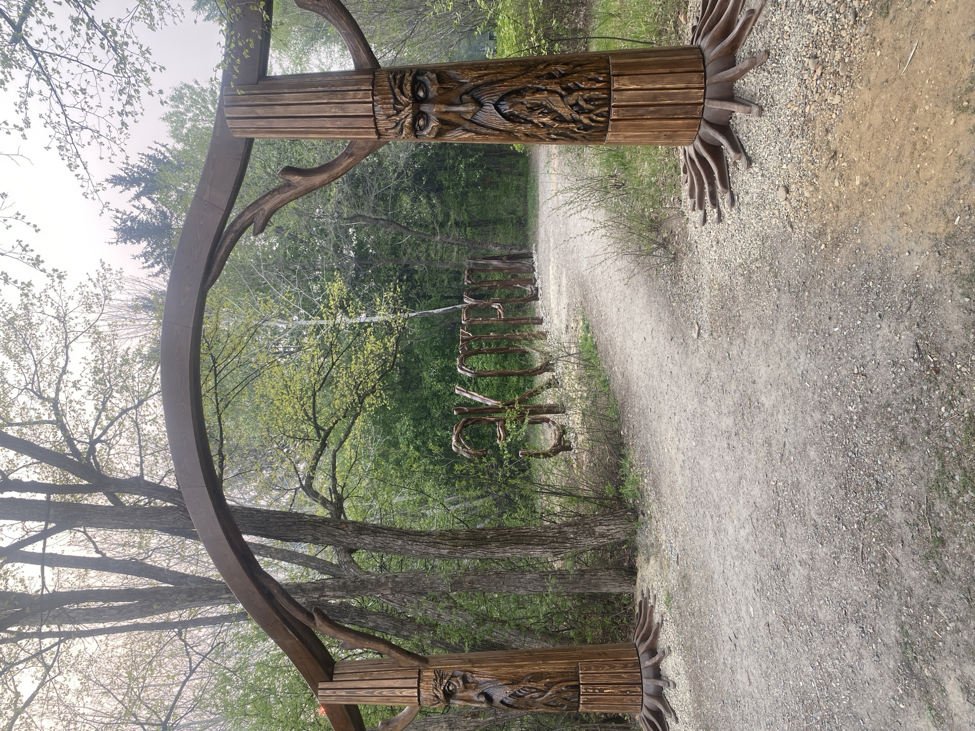 Morning forest park walk documented with sculptures and wildlife features