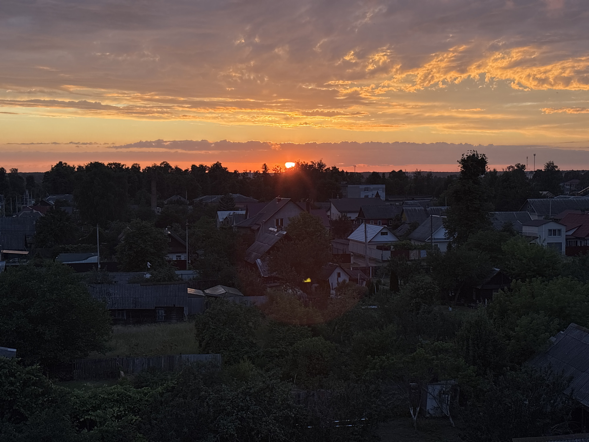 Vivid sunset over a rural Belarusian village, multiple angles