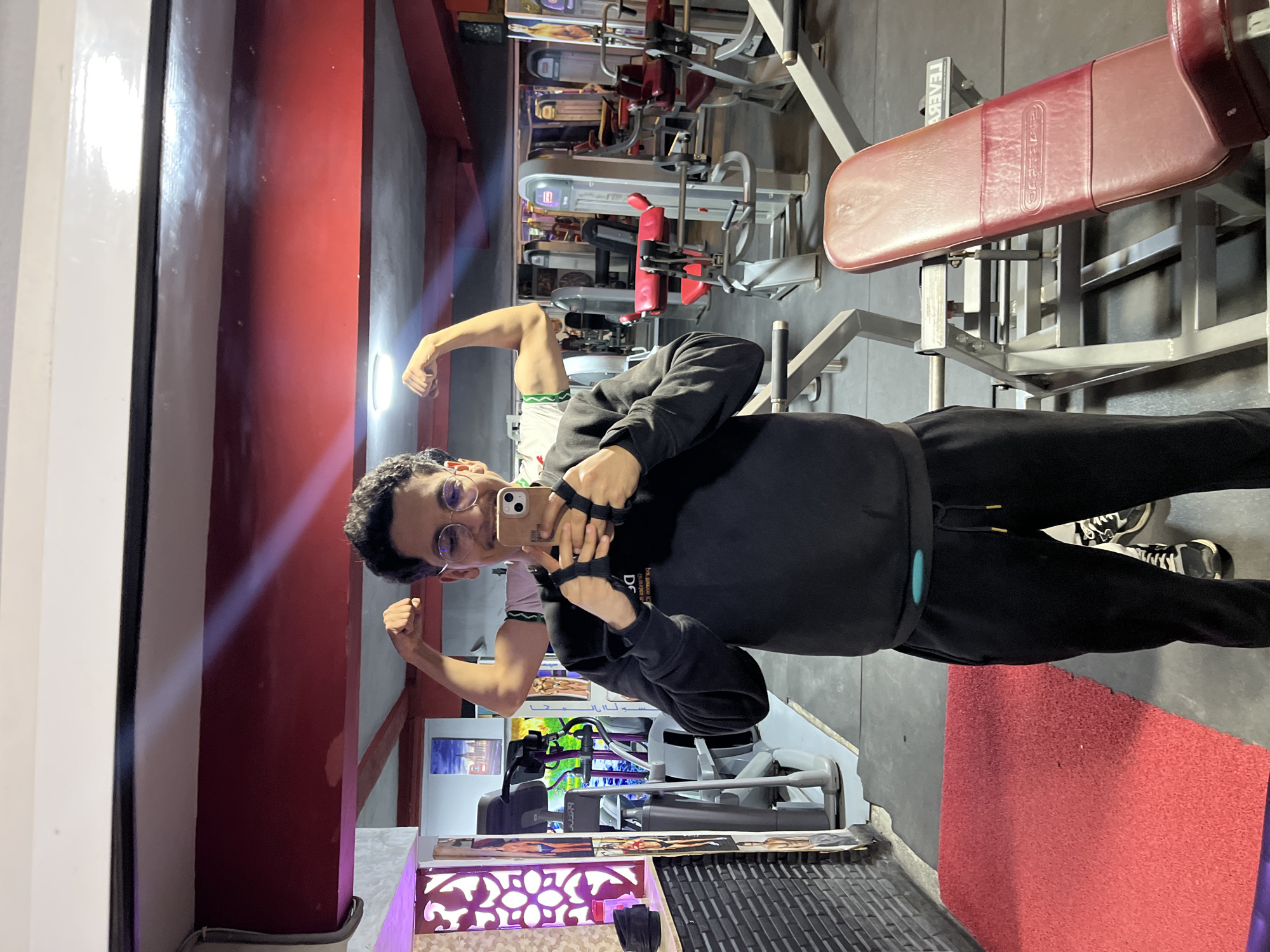 Young man exercises, takes selfie at Fez gym