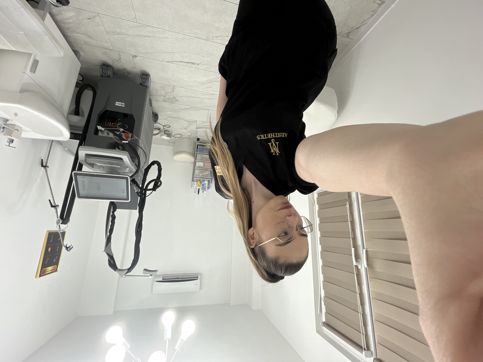 Medical aesthetics worker takes selfies during clinic visit
