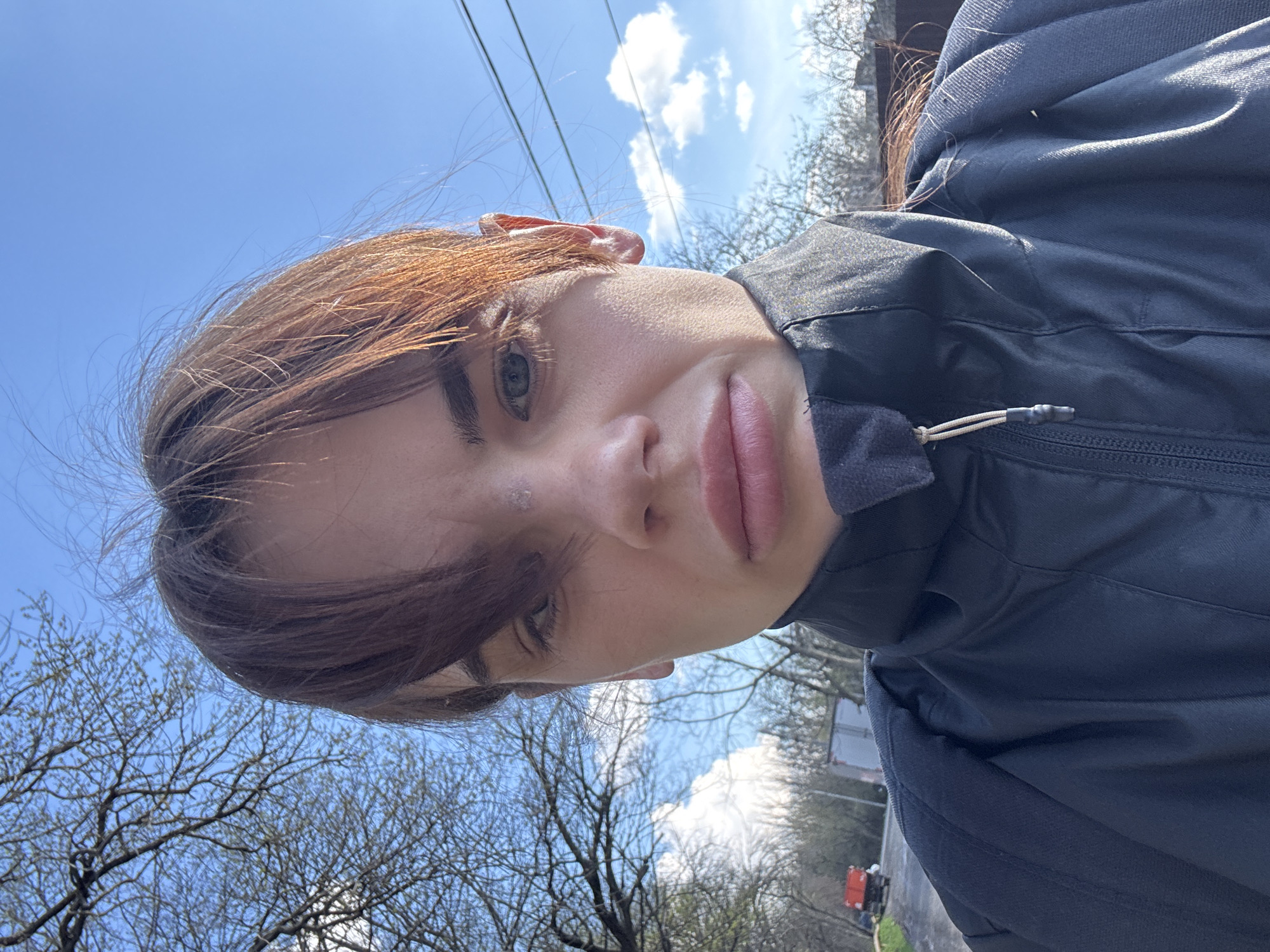 Woman takes spring selfies in Rostov-on-Don park