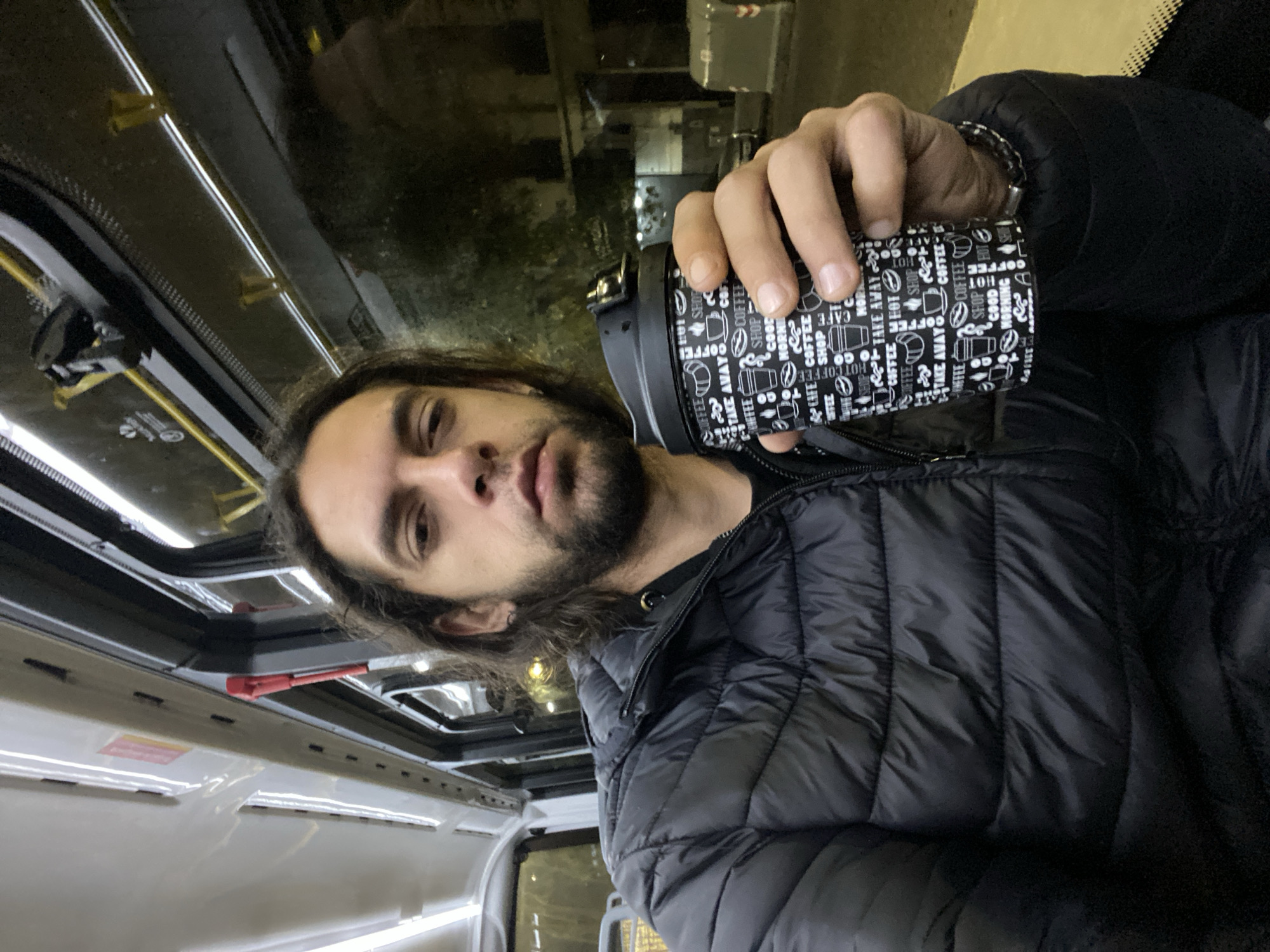 Man with coffee mug observed in Buenos Aires morning scene