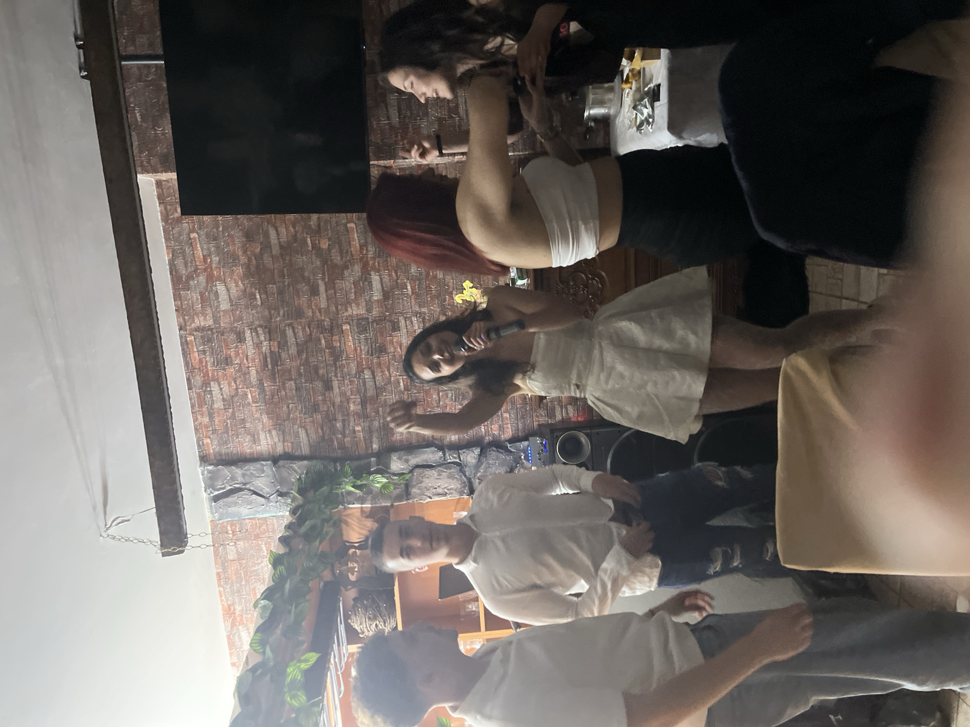 Indoor celebration with singing and dancing in Zlatograd, Bulgaria