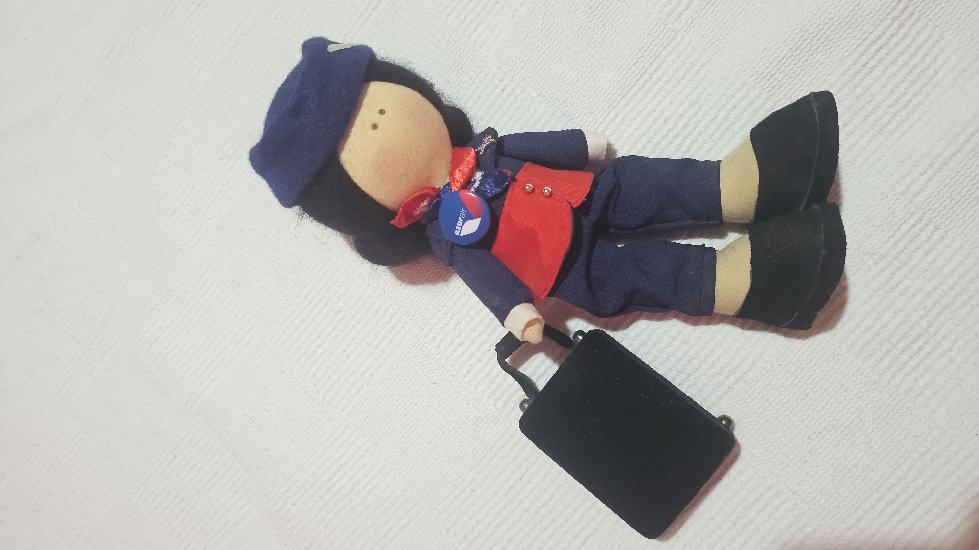 Flight attendant doll in full uniform on display