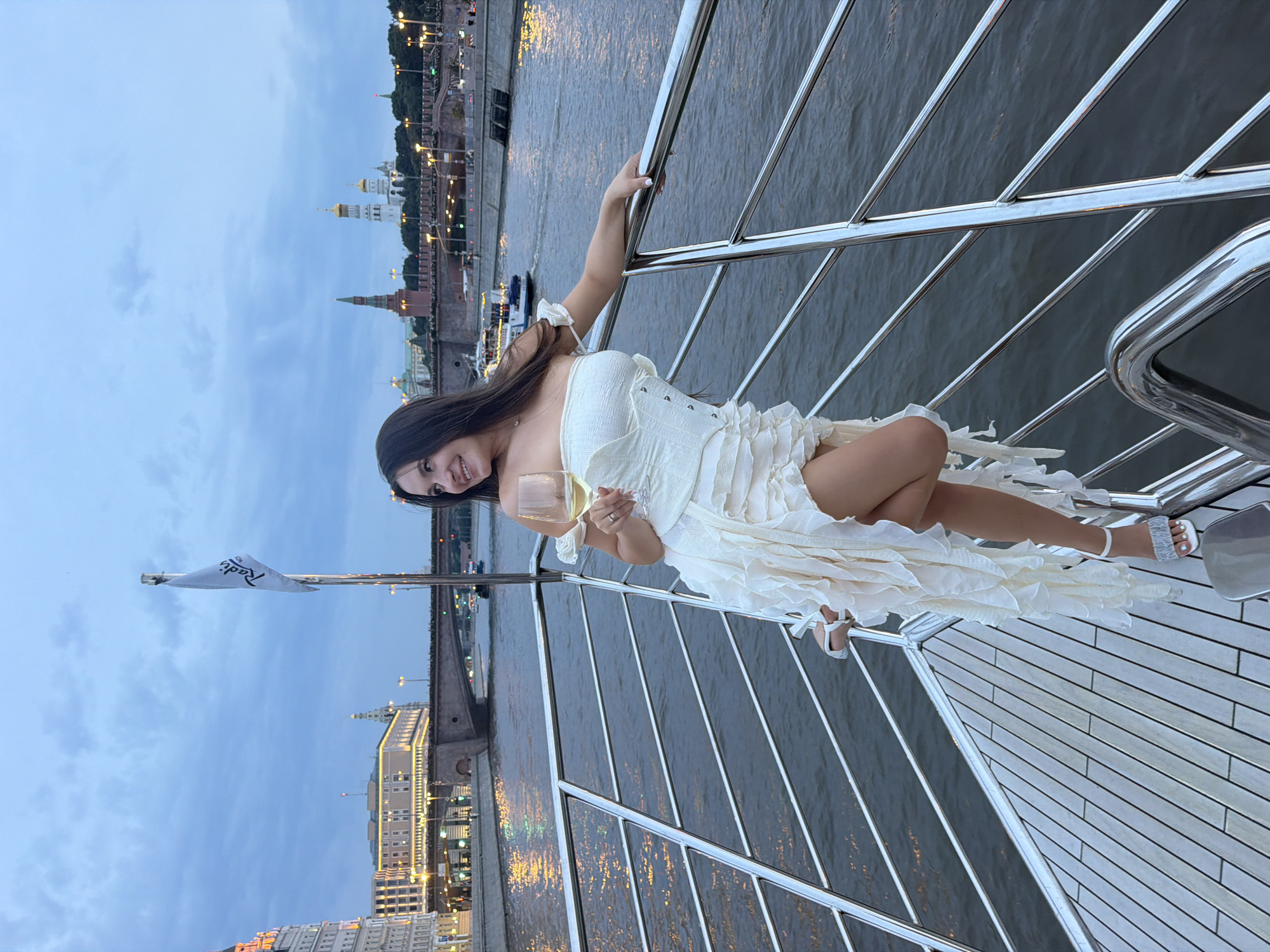 White wine and white dress on the Moscow River