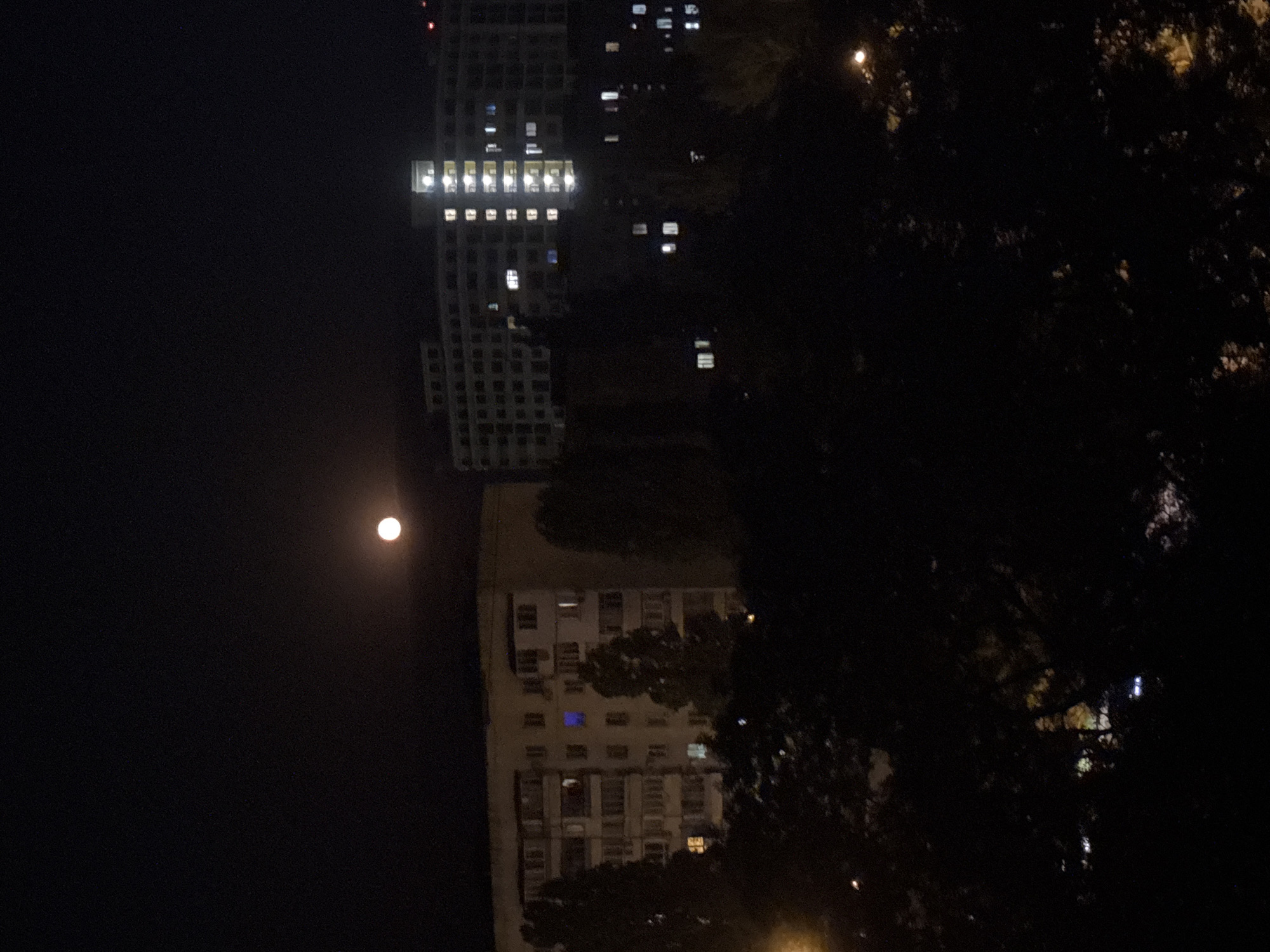Full moon over a residential Odesa neighborhood at night