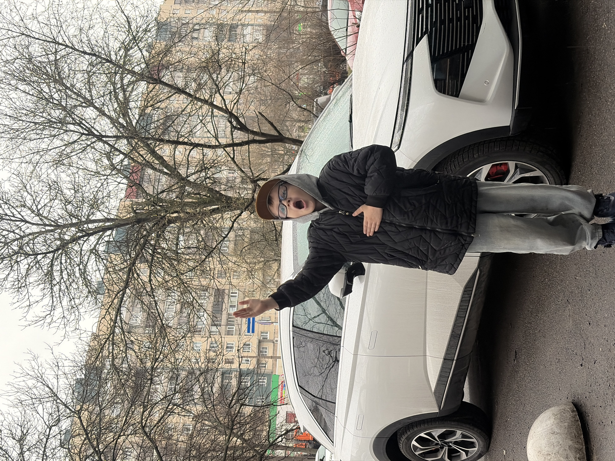Family car trip through rainy Saint Petersburg streets