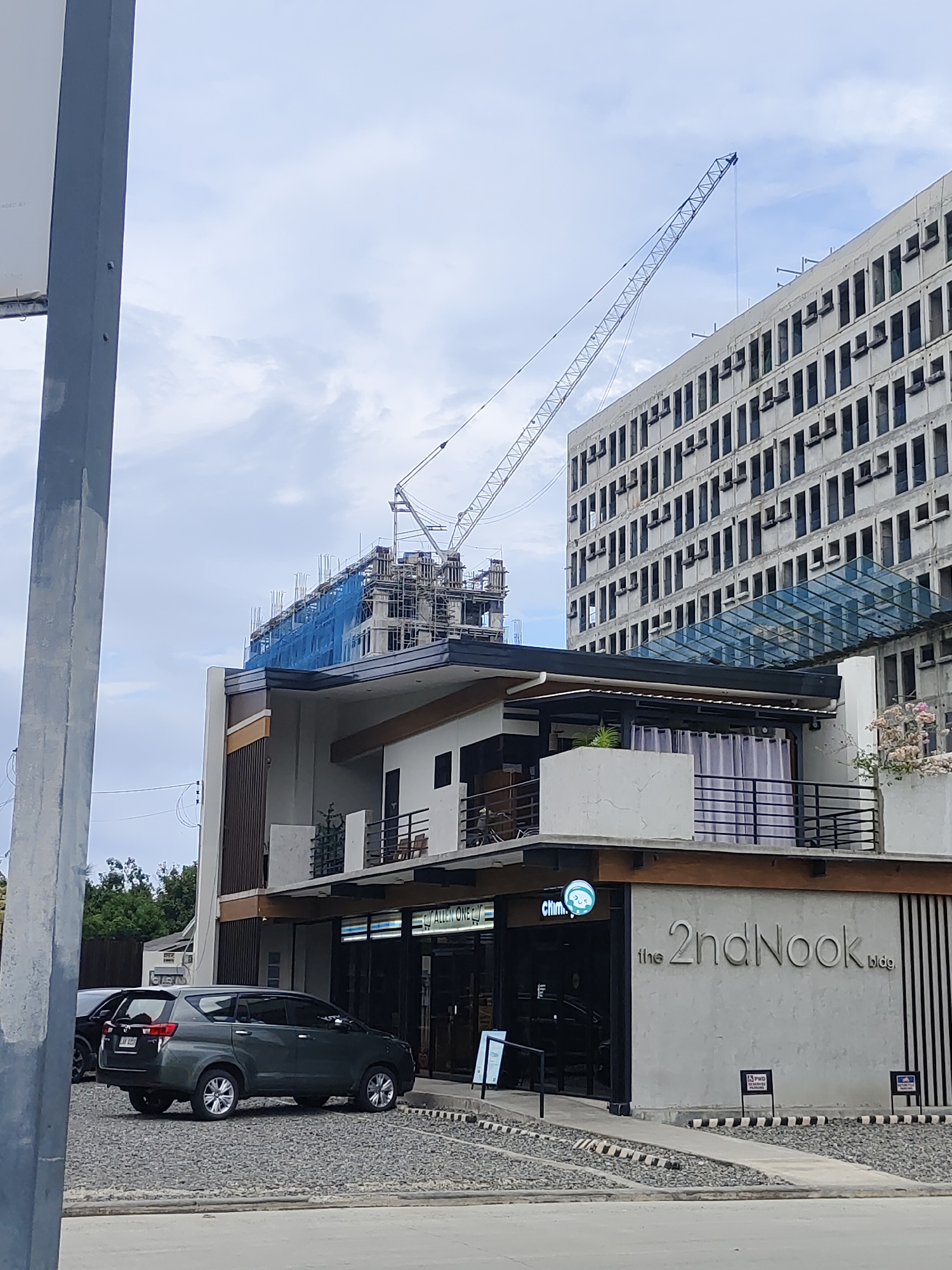 Urban morning scenes show construction, church, residents near coordinate 666