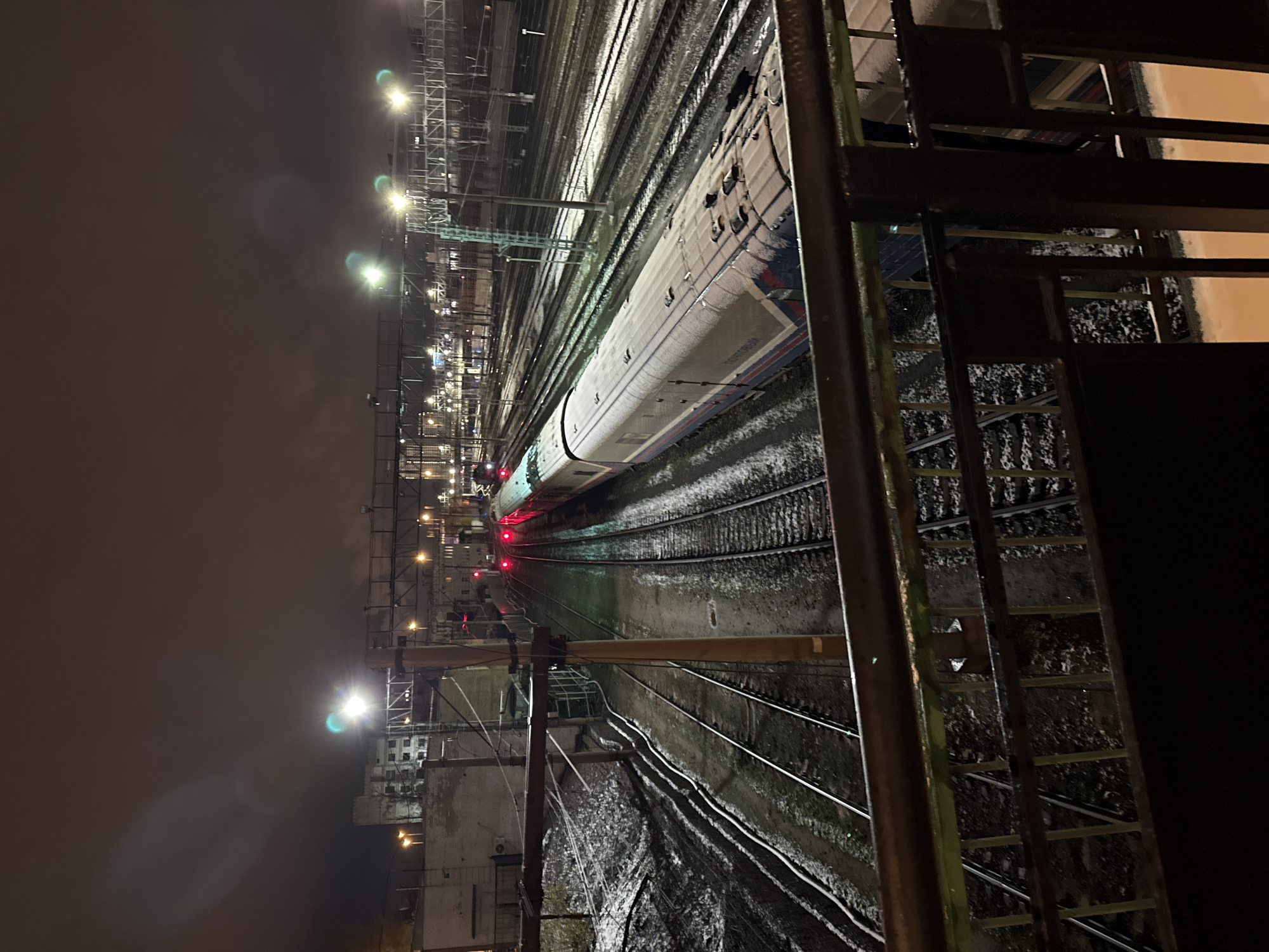 Moscow evening captures tattoo session, snowy train station