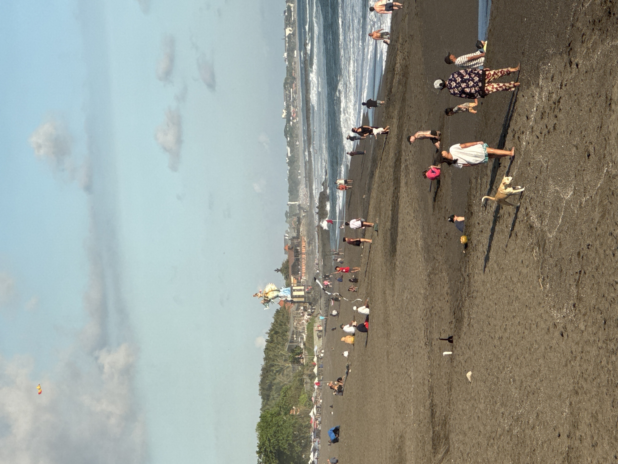 Busy beach day captured at Munggu, Indonesia