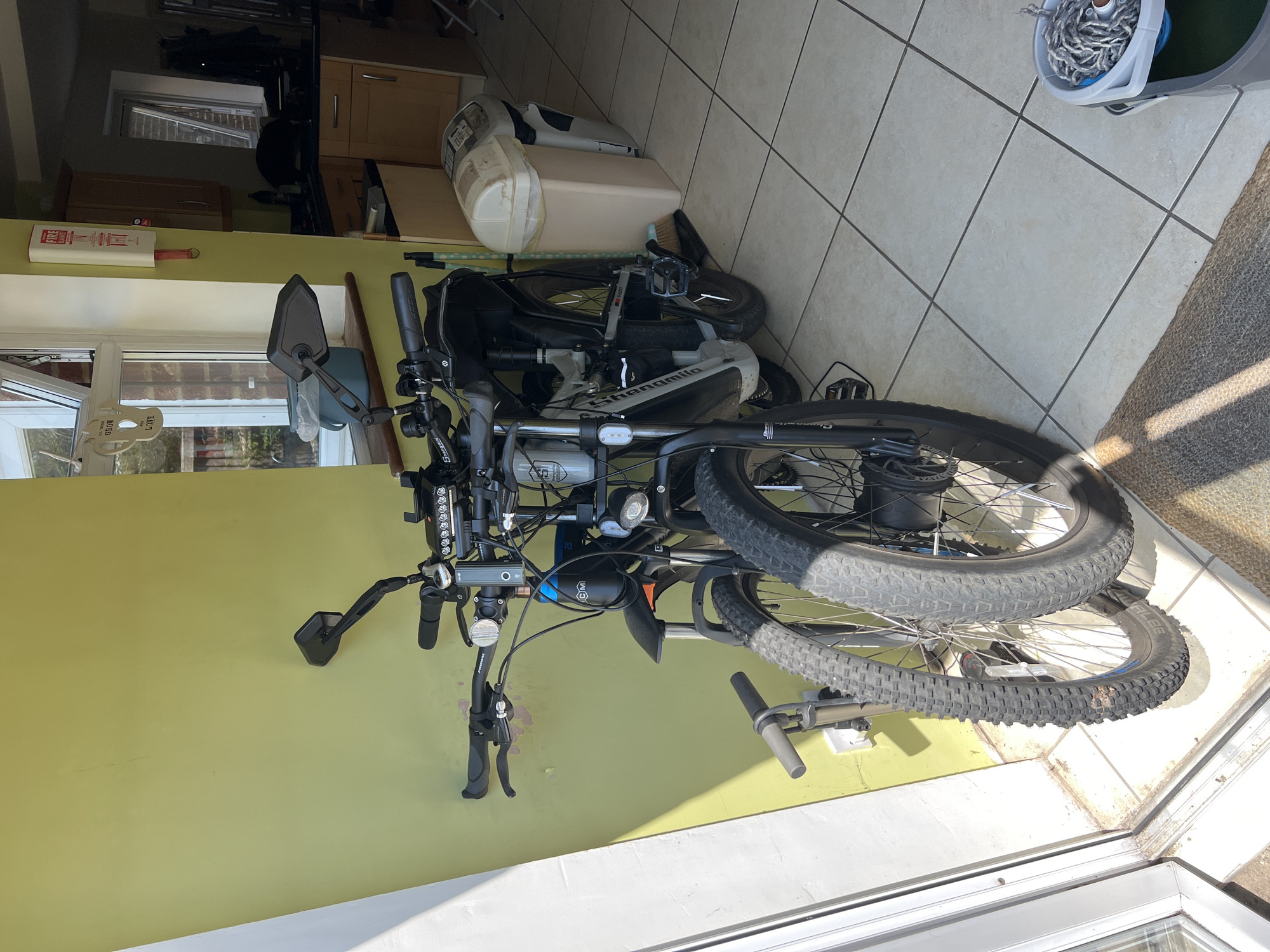 Electric bikes parked indoors at a Guildford property