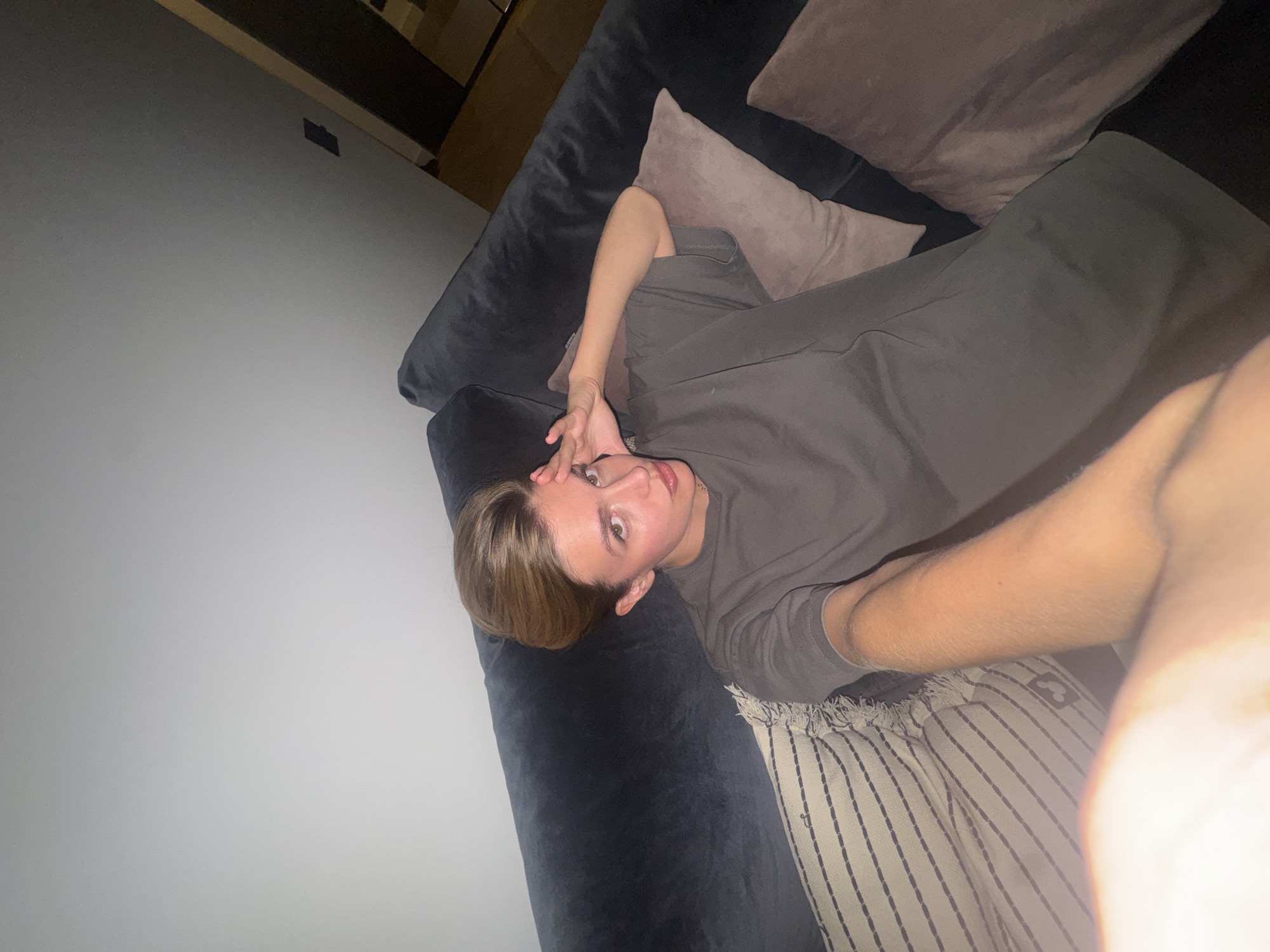 Person resting on couch captured in Yerevan home