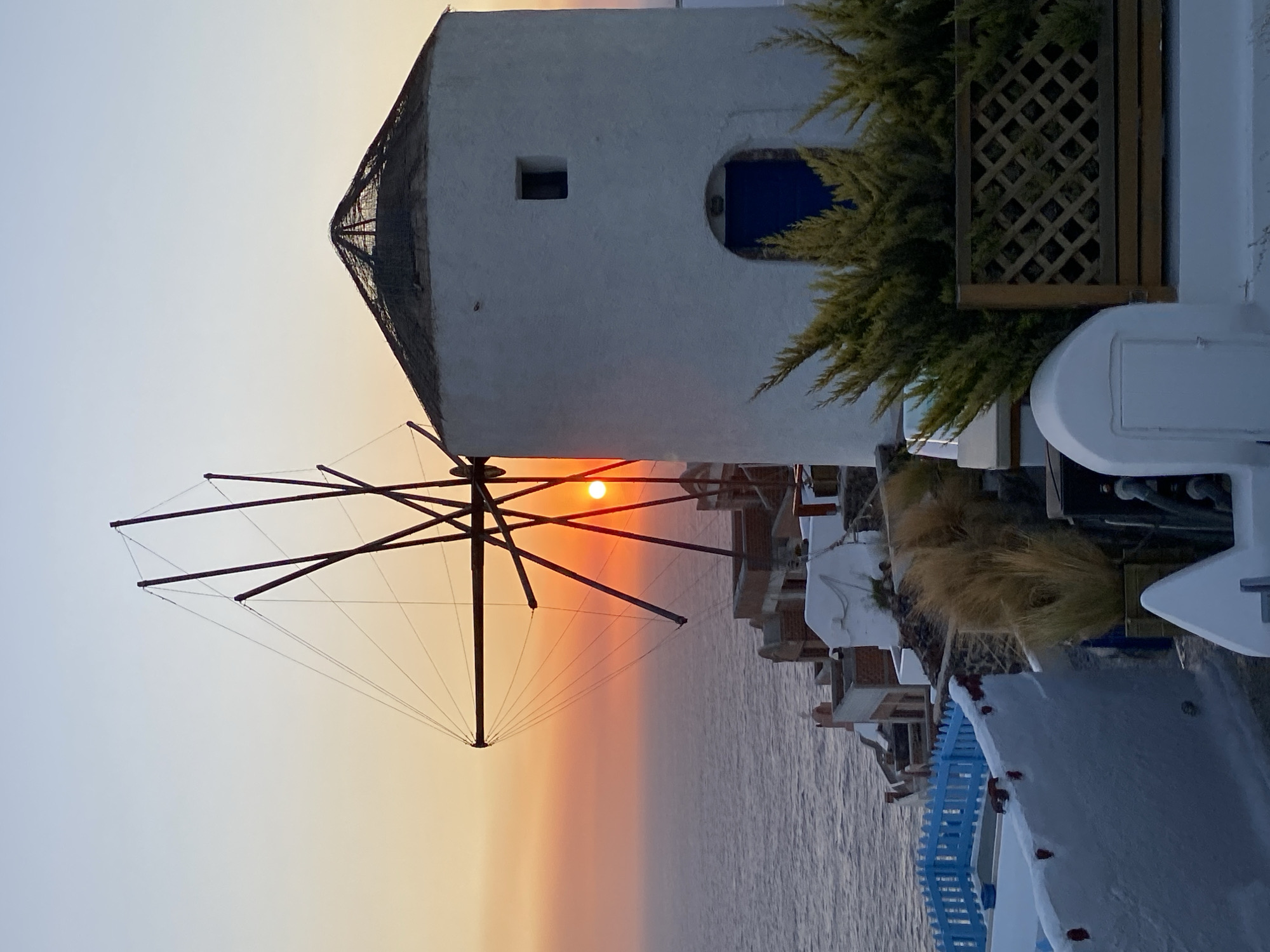 Sunset hour at Oia's windmills, Santorini