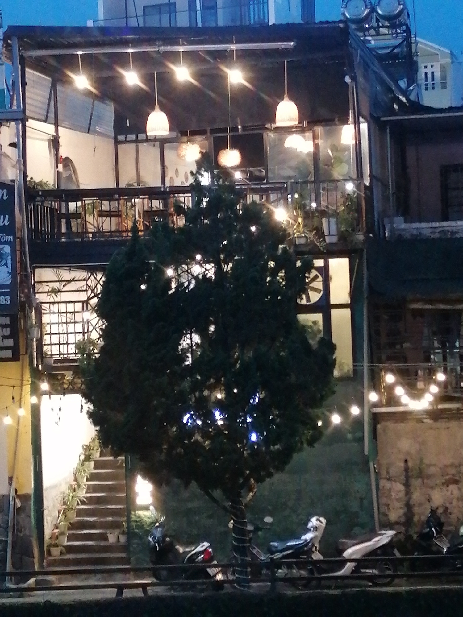 Da Lat streets at dusk, lights coming on