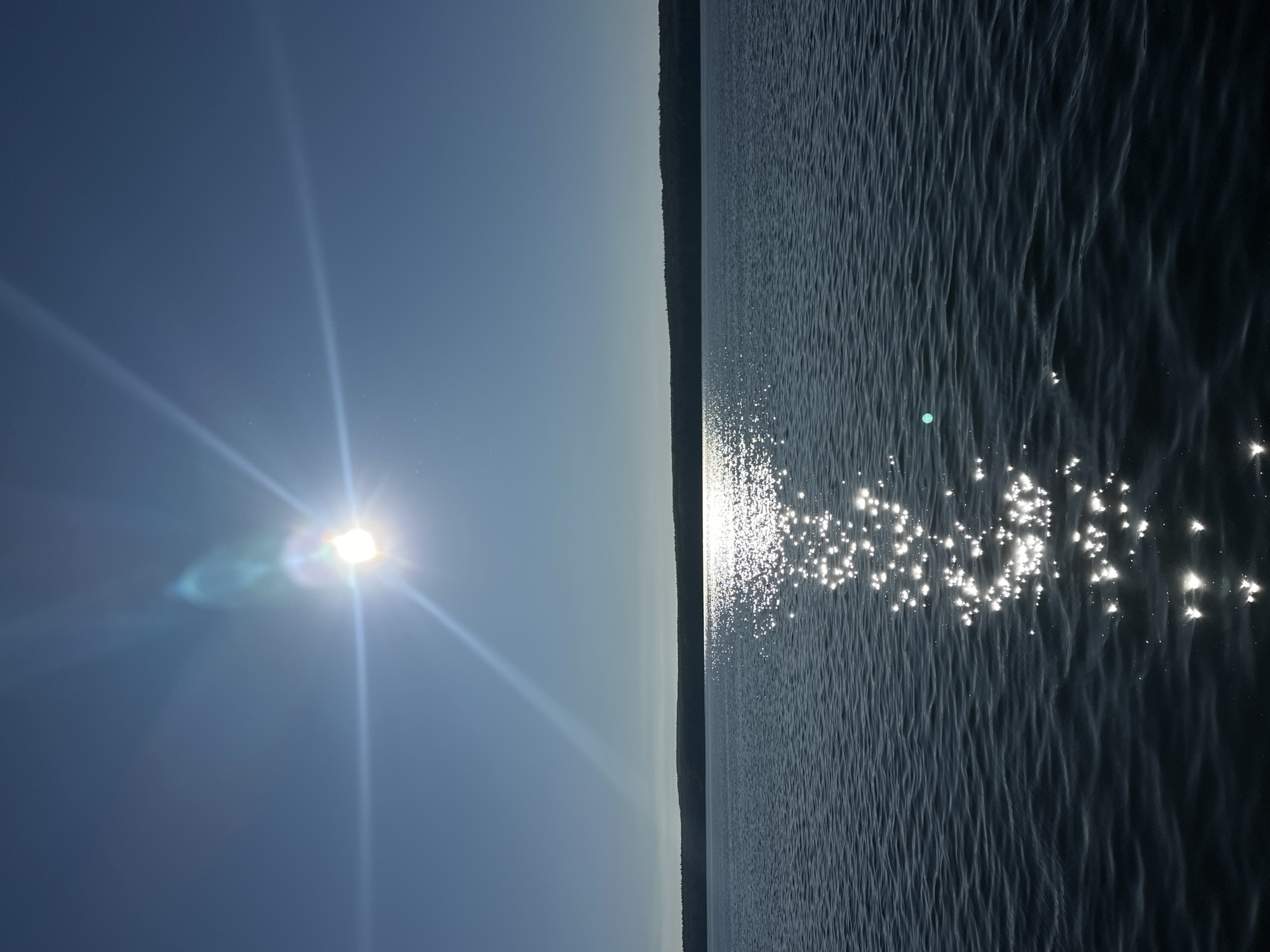 Dawn reflection photographed on water near Chaikovsky, Russia