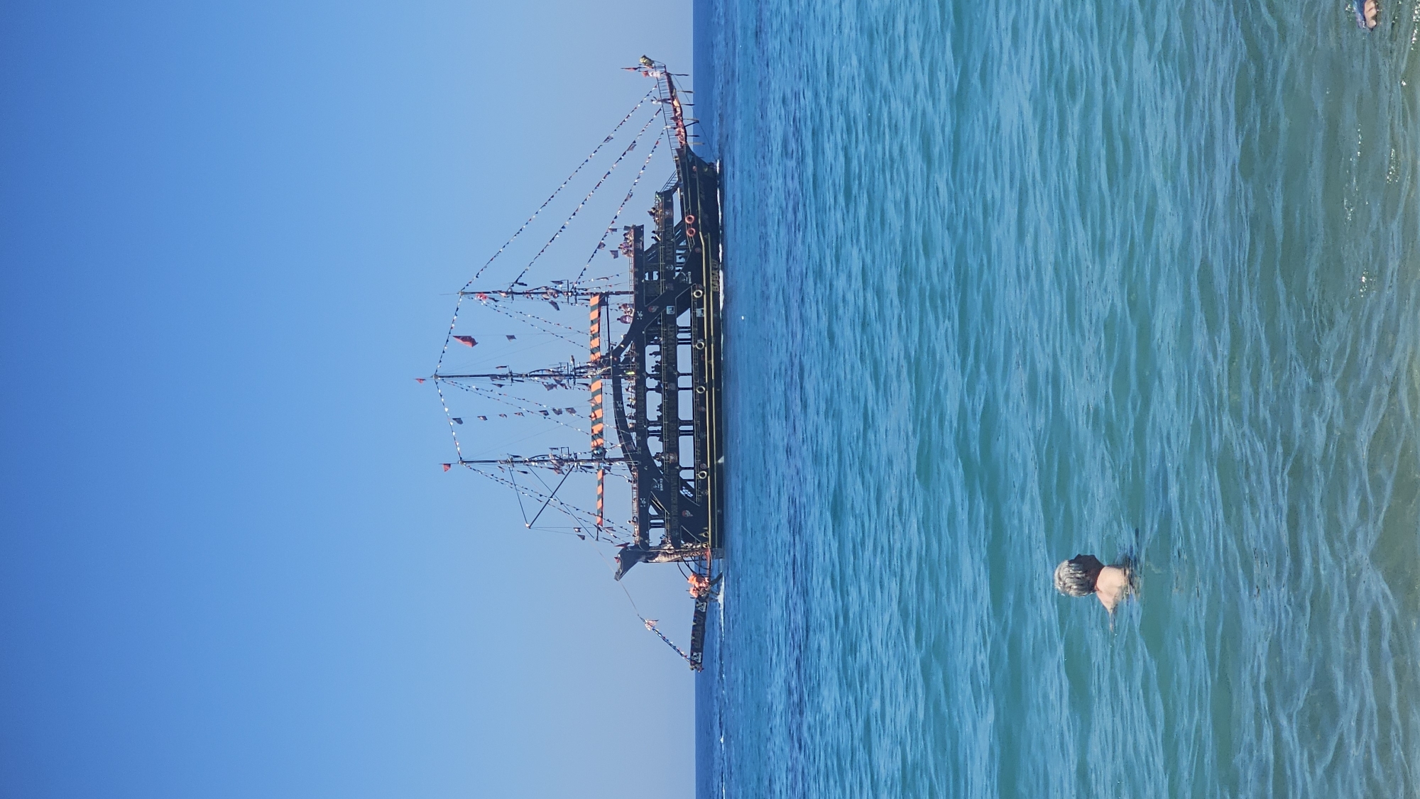 Alanya beach in full summer swing, pirate boat included.