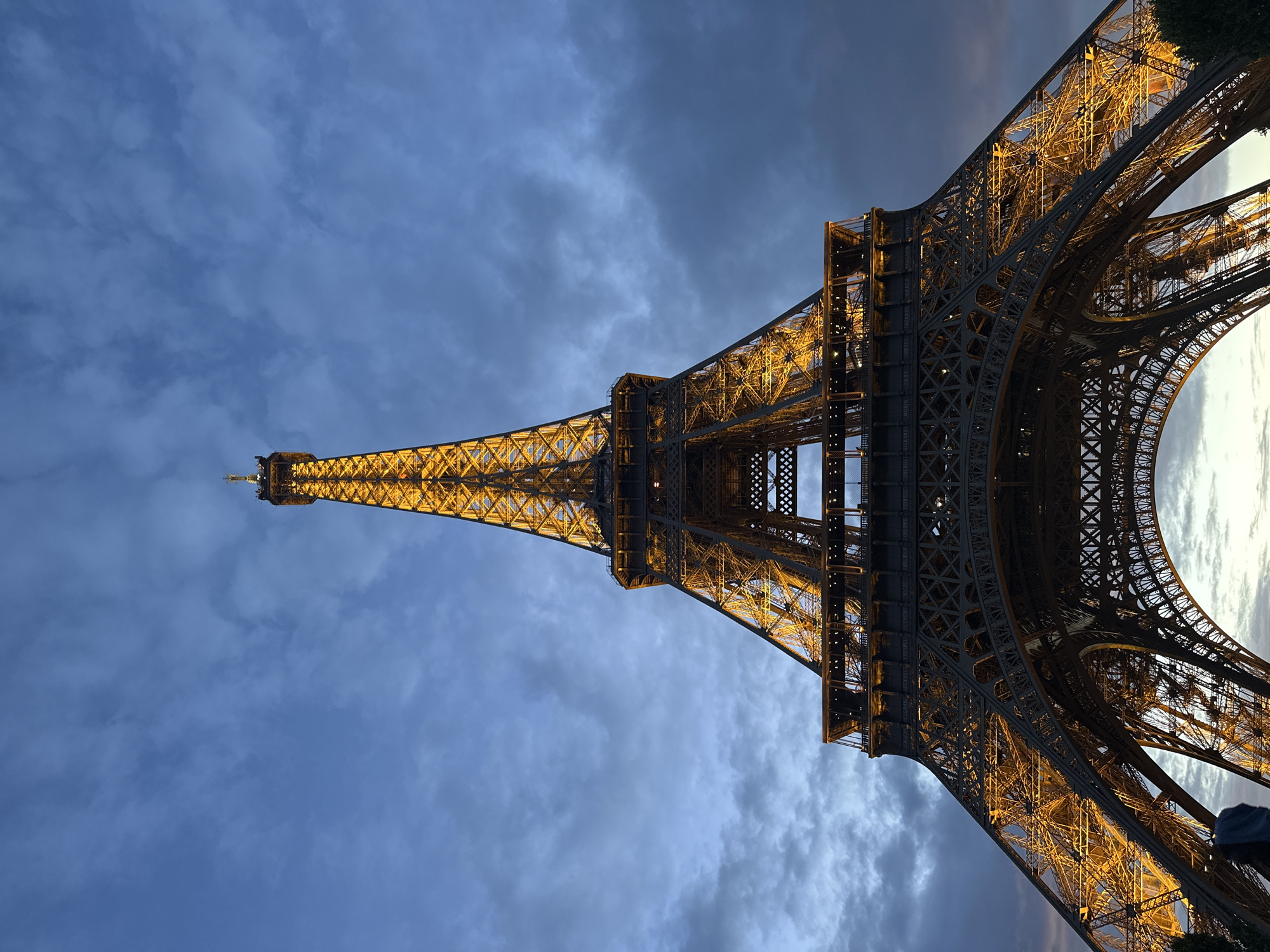 Eiffel Tower glows golden during Paris twilight hour