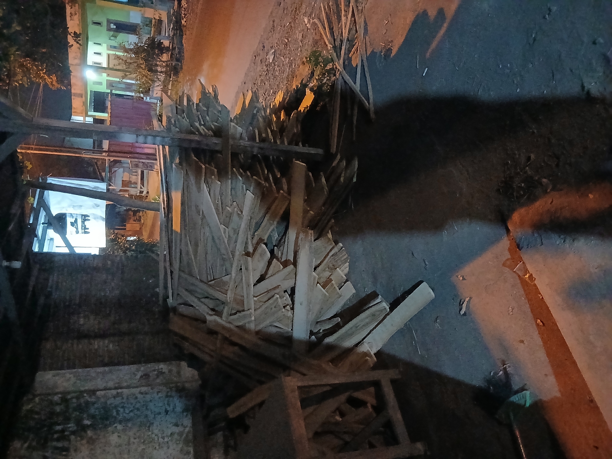 Late-night street scenes across two Indonesian neighborhoods