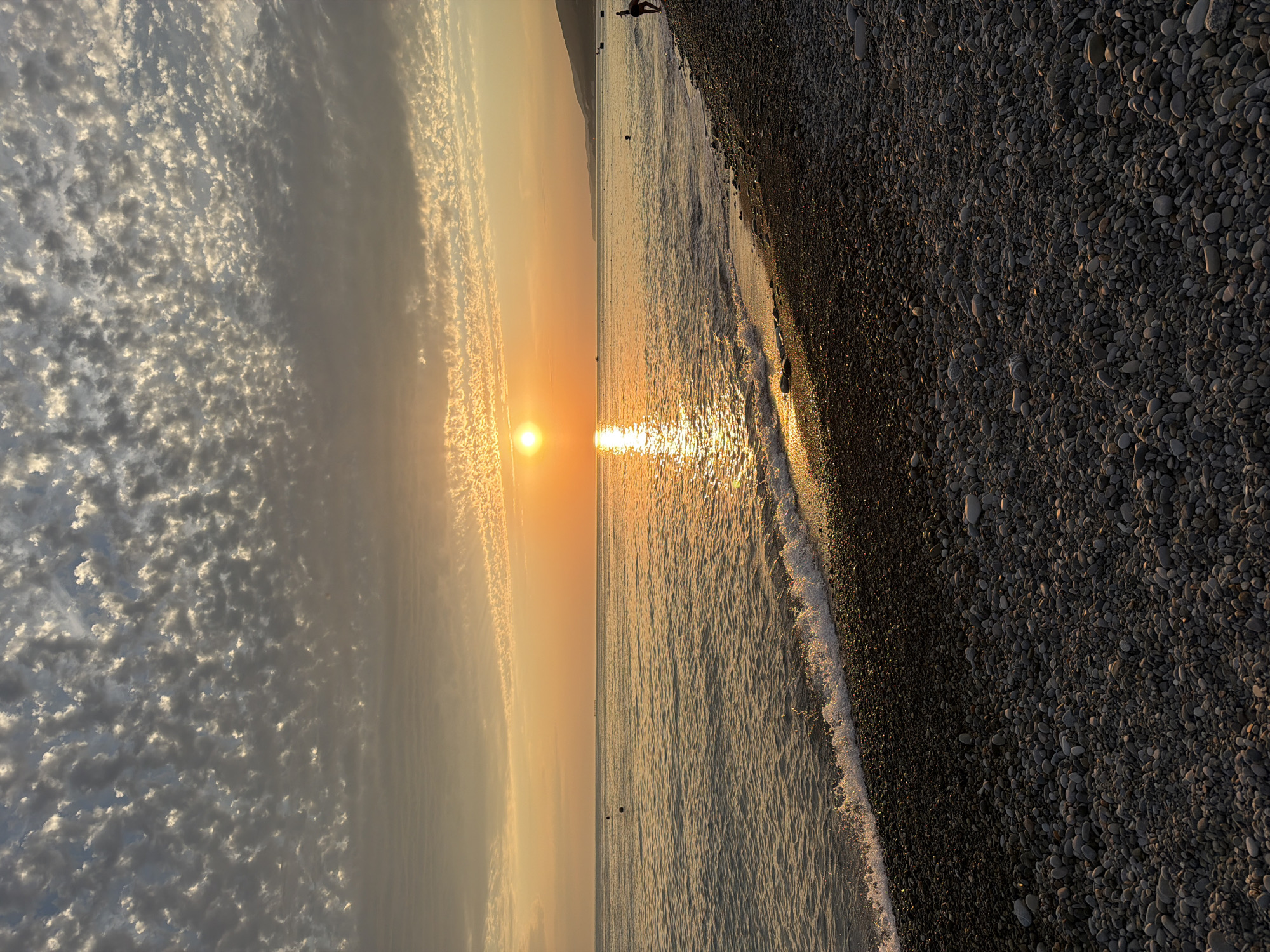 Sunset evening on Sochi's Black Sea pebble beach