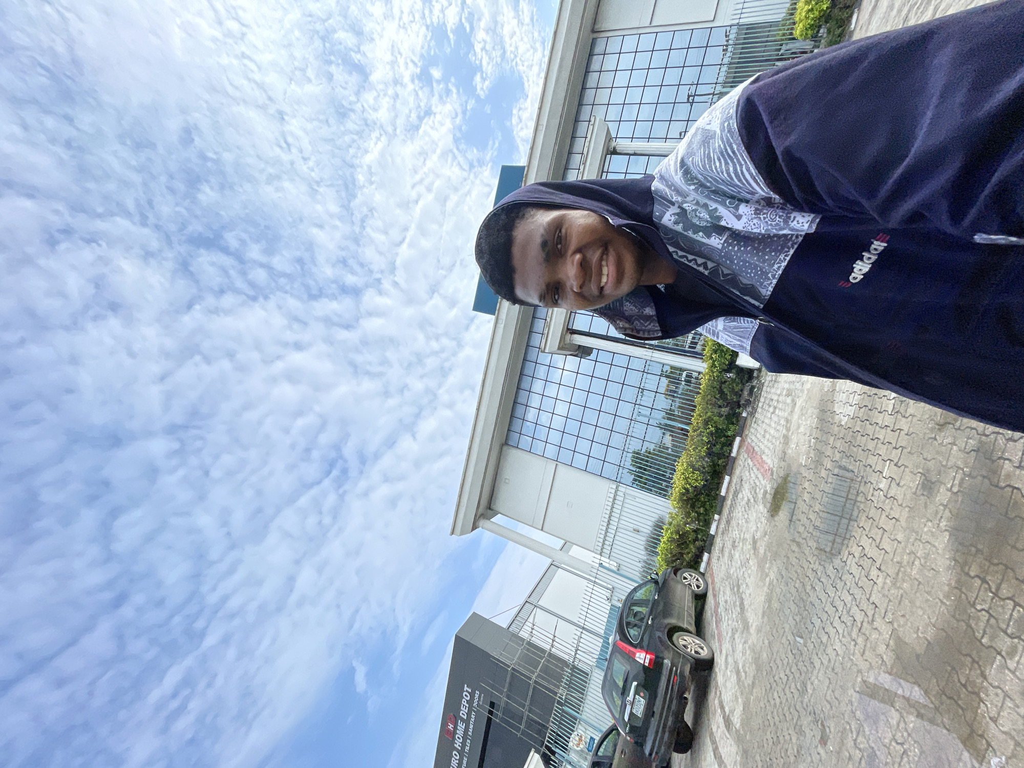 Young man takes morning selfies near Ilado commercial district