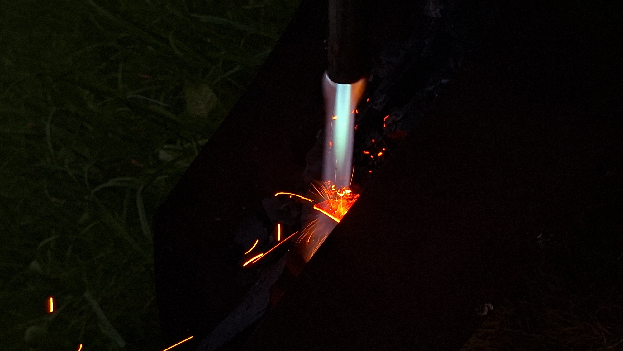 Midsummer backyard bonfire night in rural Belarus