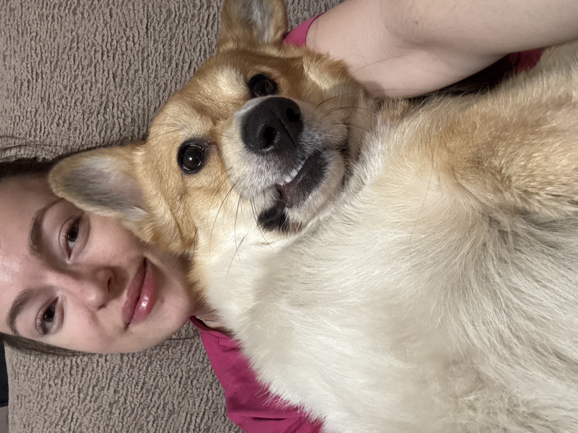 Woman poses with Corgi dog in Krasnoyarsk