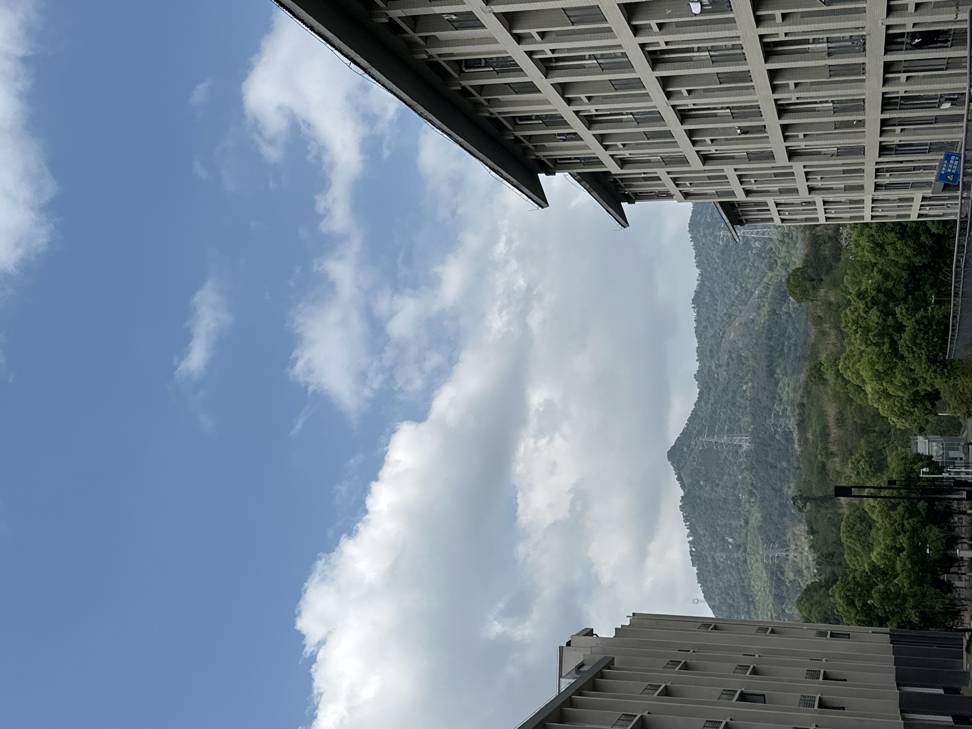 Urban skyview captures mountains and clouds in Jiangjin, China