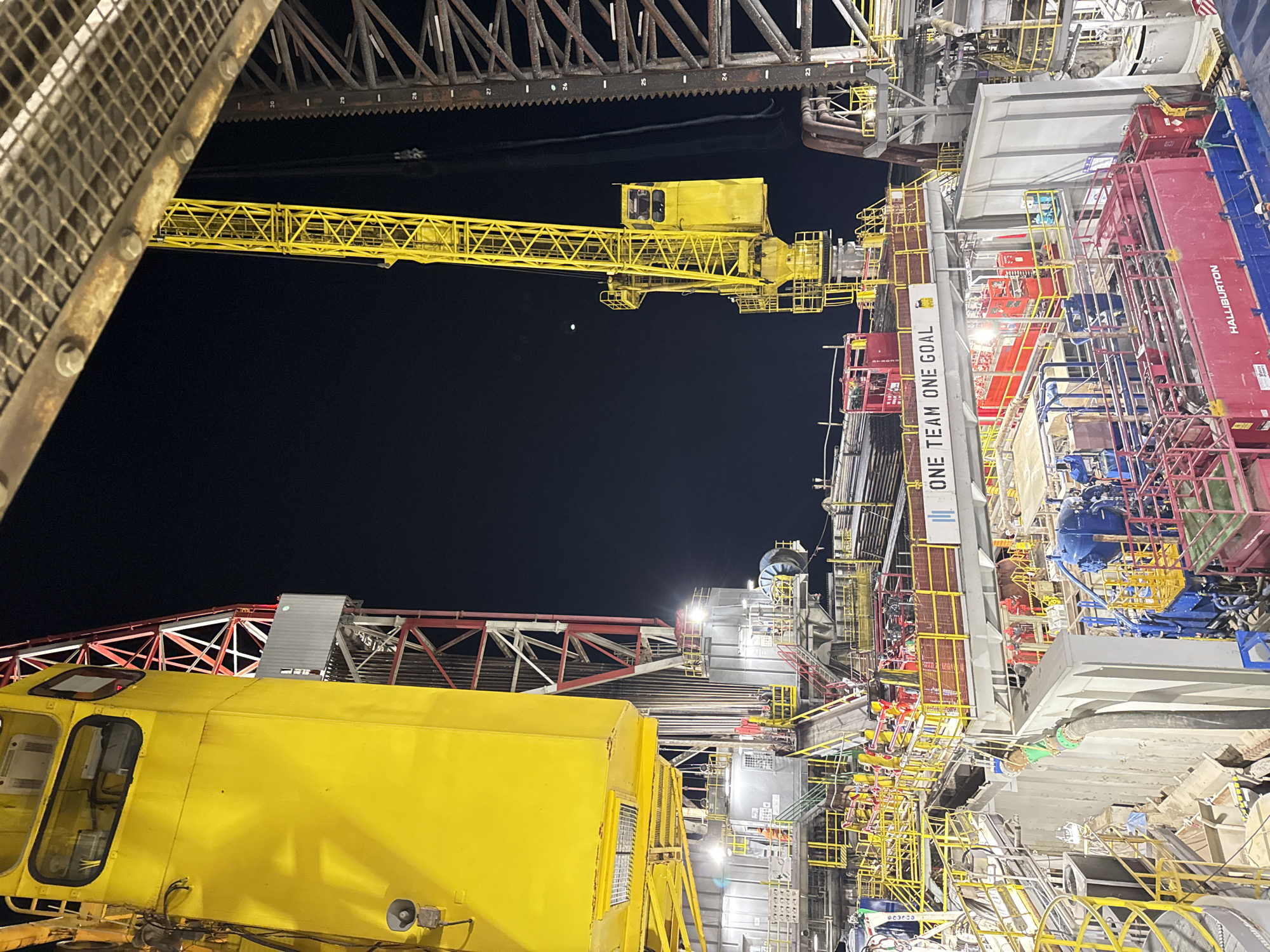 Industrial oil rig facility observed at night in Italy